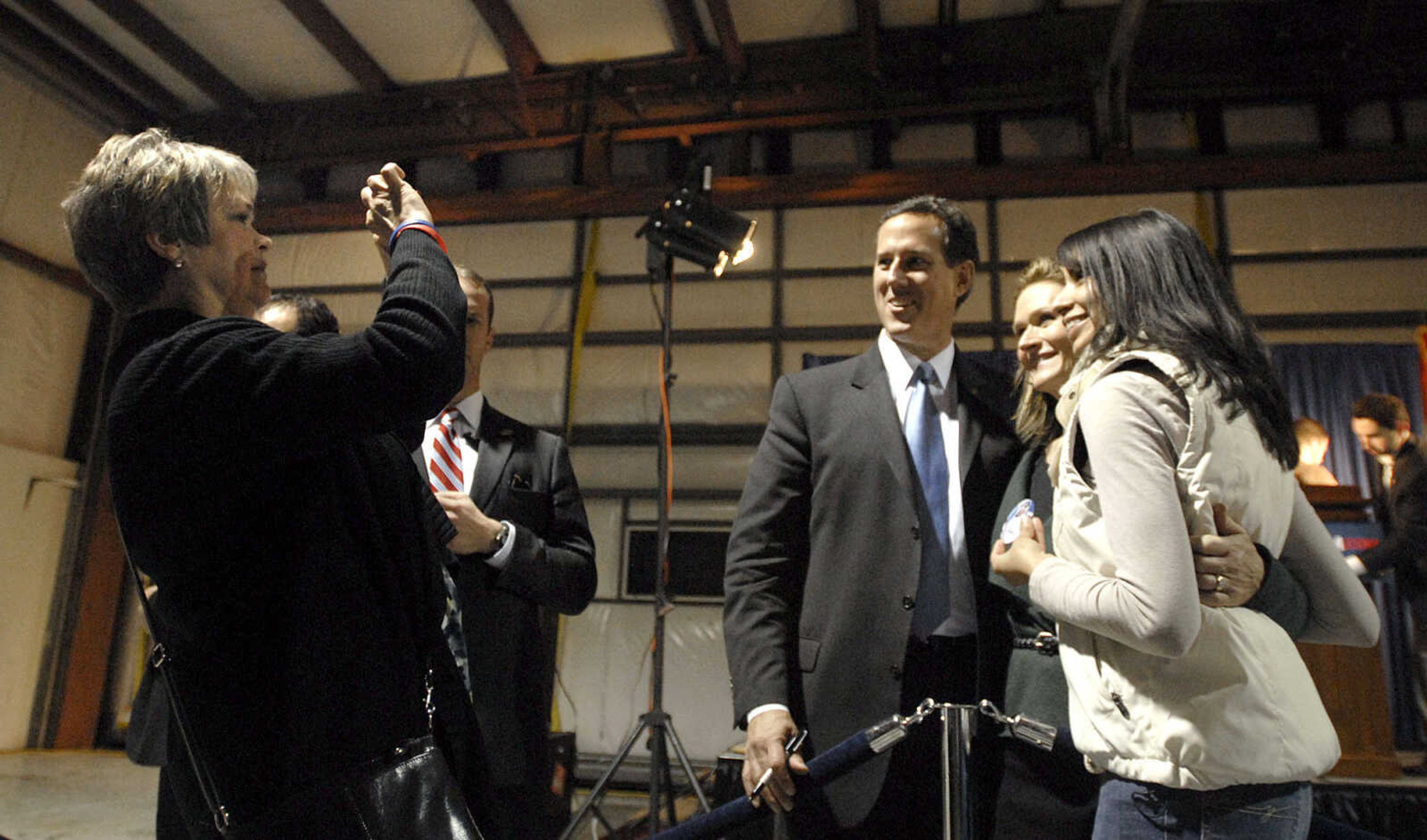 LAURA SIMON ~ lsimon@semissourian.com
Republican presidential candidate Rick Santorum and his wife Karen pose for a photo Saturday night, March 10, 2012 during his campaign stop at the Cape Girardeau Regional Airport.