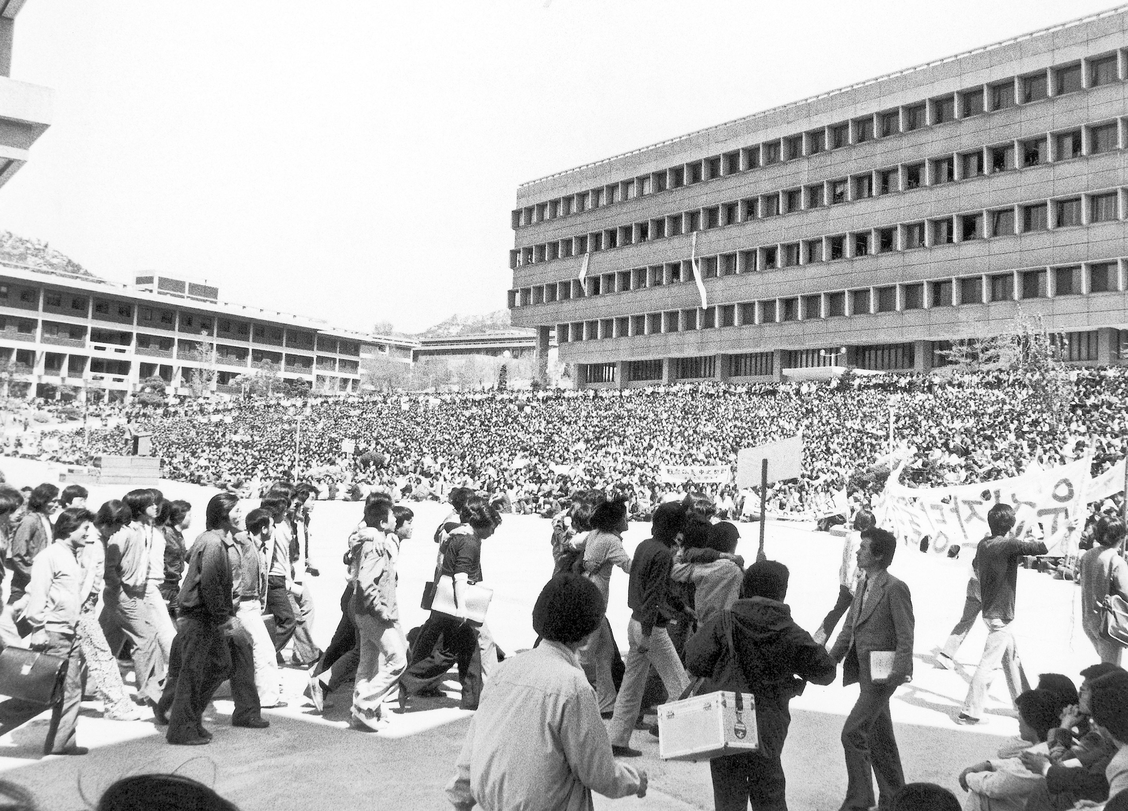 FILE- Some 10,000 students of Seoul National University hold a campus rally on Friday, May 2, 1980 to demand the lifting of martial law and the resignation of Premier Shin Hyon-Hwack and Korean Central Intelligence Chief Lt. Gen. Chin Doc-Hwan. (AP Photo/Kim Chon Kil, File)