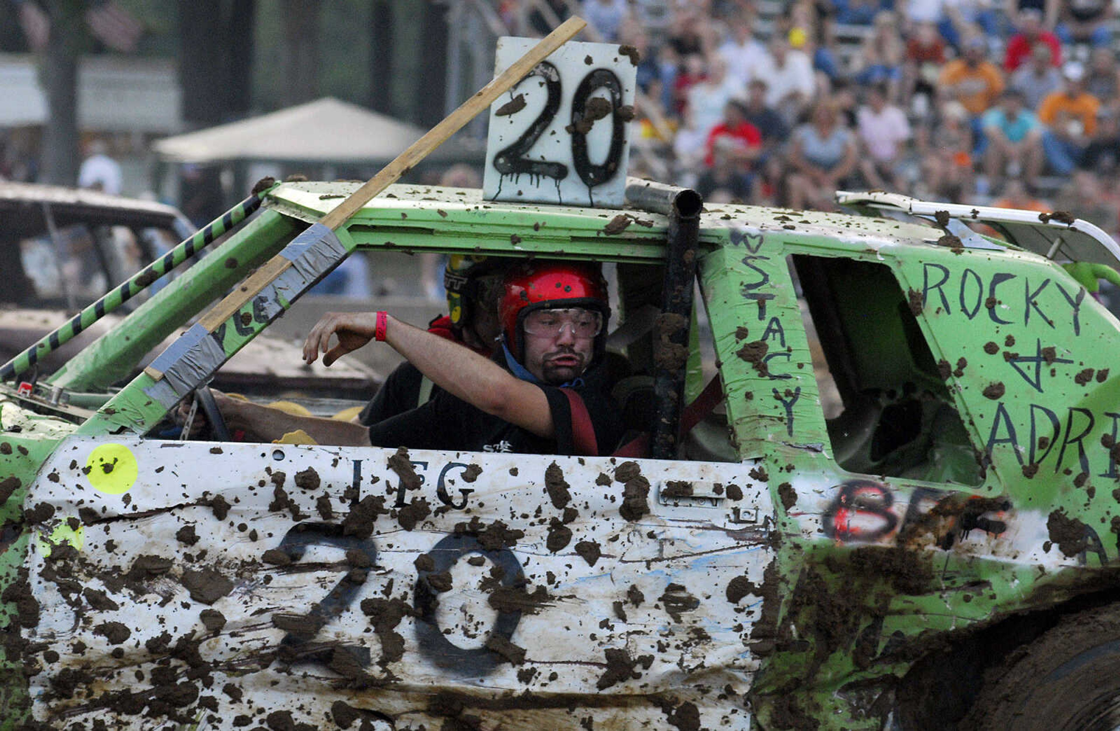 LAURA SIMON~lsimon@semissourian.com
Darrin Hobeck reacts after being slammed into during the dual demolition derby at the U.S.A. Veterans Fourth of July celebration at Arena Park in Cape Girardeau Sunday, July 4, 2010.