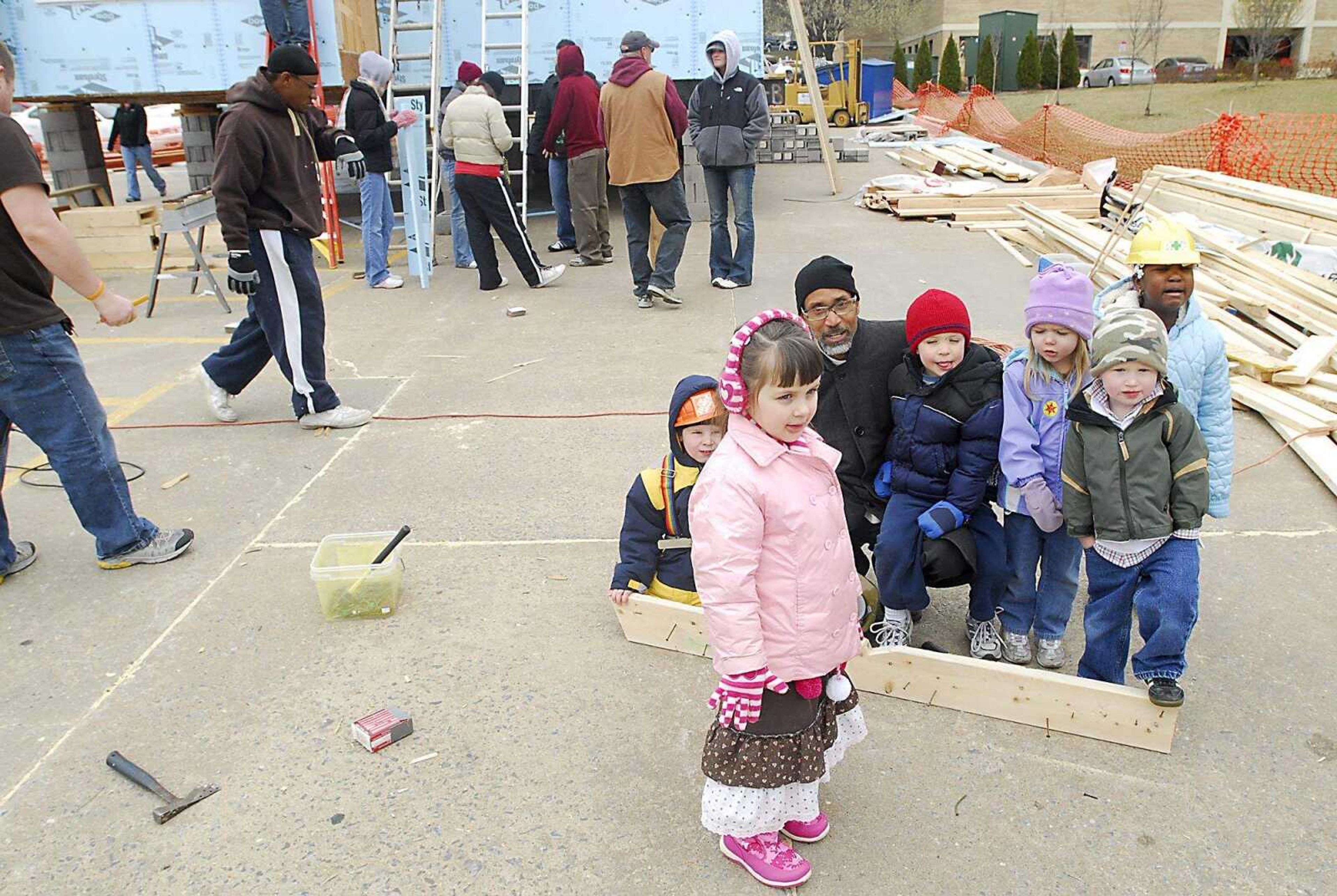 KIT DOYLE ~ kdoyle@semissourian.com
Mark Bartlett's Center for Child Studies preschool class takes a field trip to the Habitat for Humanity home being built in the Alumni Center parking lot Thursday, March 12, 2009, in Cape Girardeau.