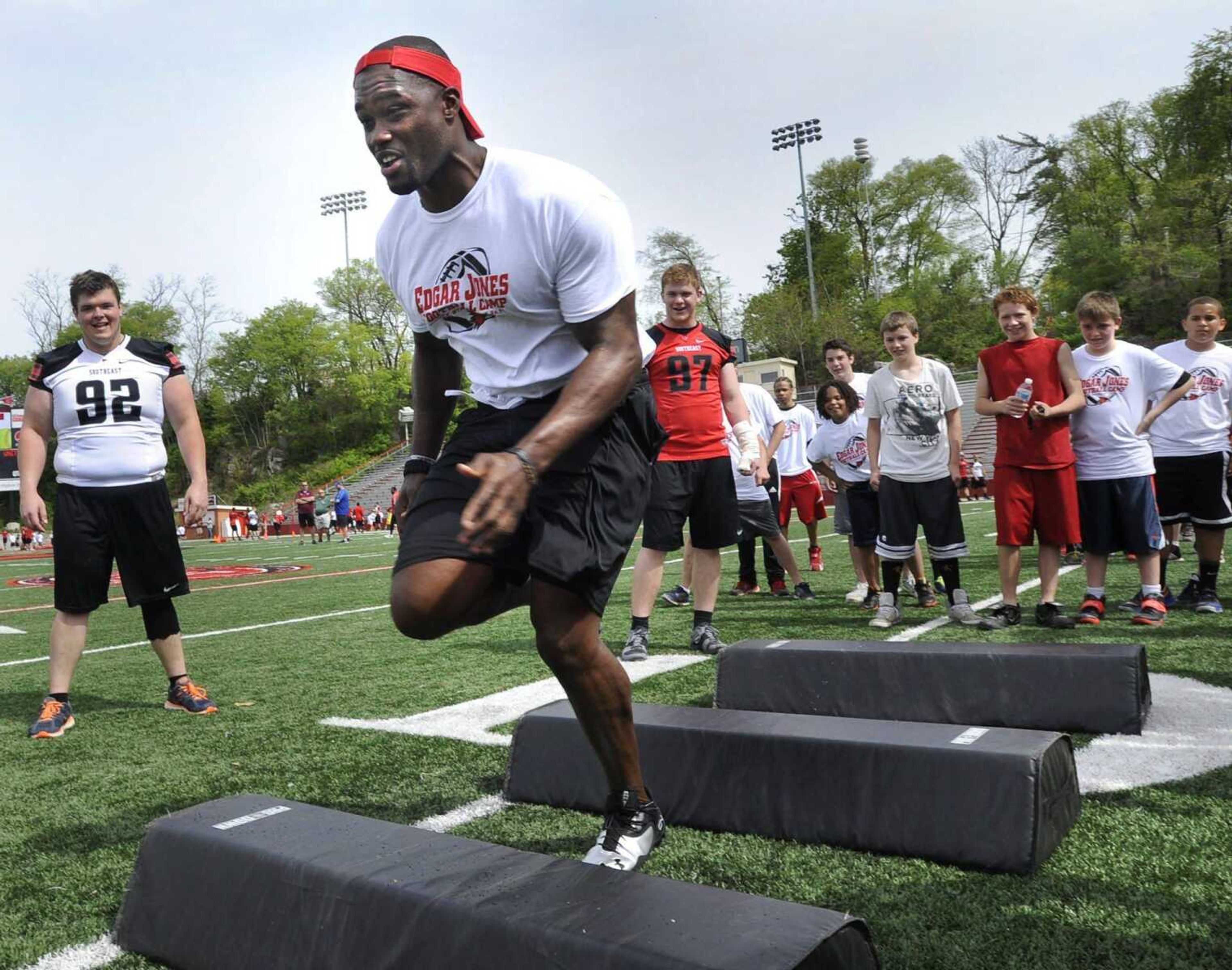 Edgar Jones, who played for the Dallas Cowboys last season and is a Southeast Missouri State University alumnus, runs a drill at his youth football clinic Saturday at Houck Stadium. (Fred Lynch)