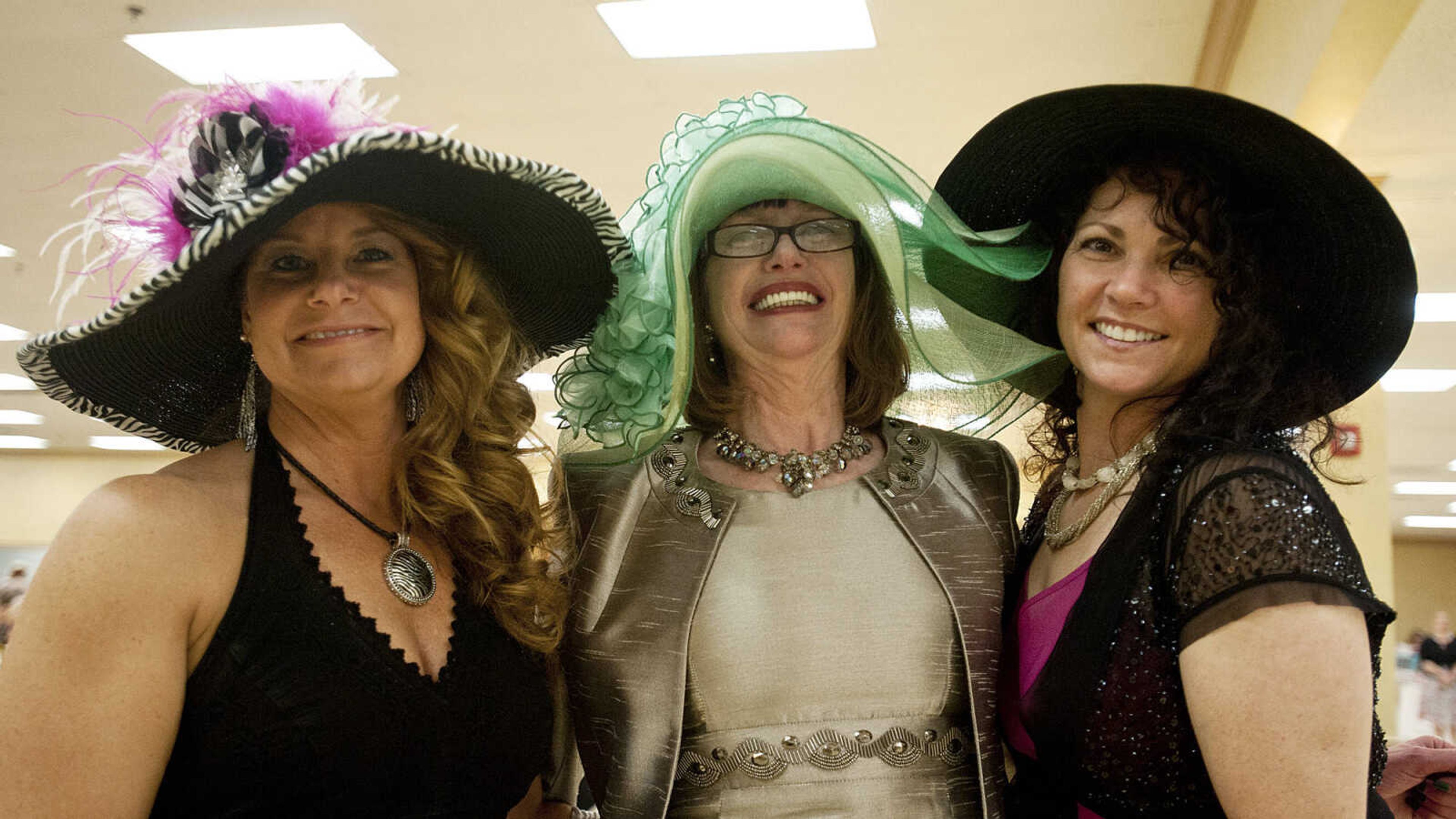 Jamie Crowell, left, Rosalee Allgood and Laura Wake at the Lutheran Family and Children's Services Foundation's "Boas & Bling, Kentucky Derby Party," Thursday, May 1, at The Venue in Cape Girardeau.