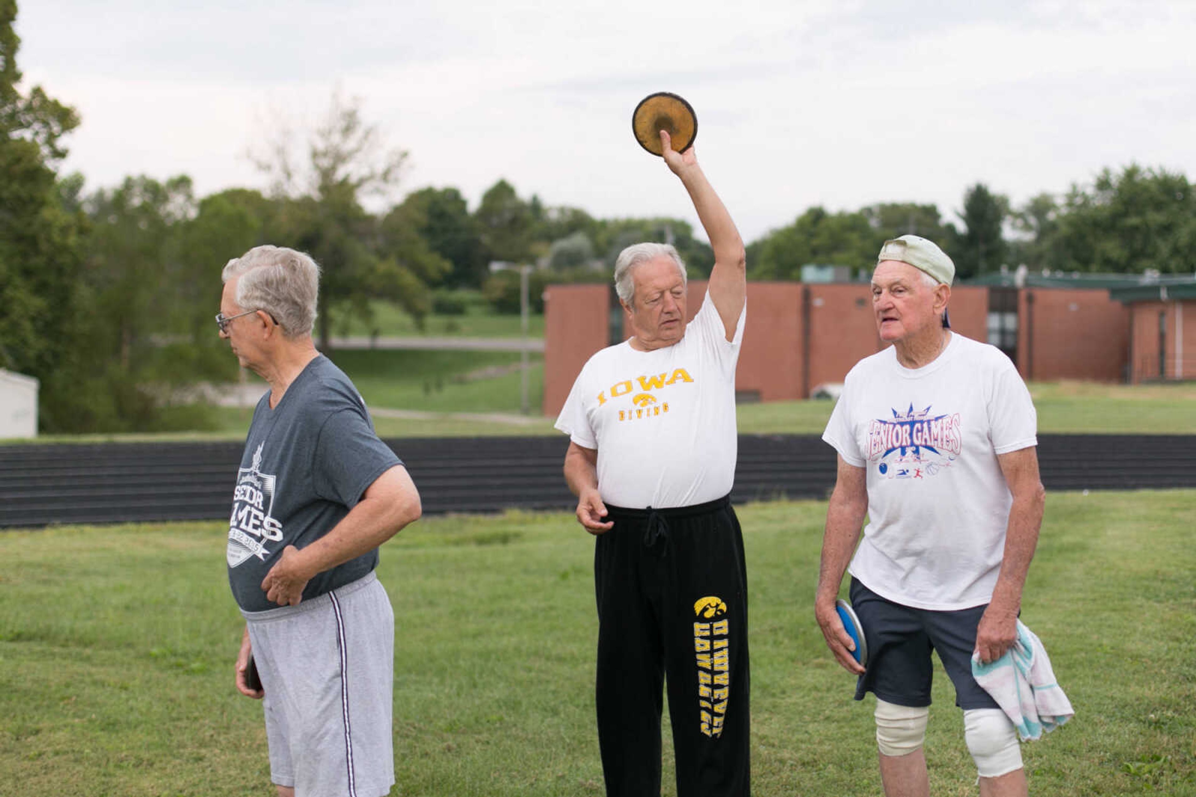 GLENN LANDBERG ~ glandberg@semissourian.com


Alan Schenck stretches while waiting for his turn to throw the discus with Art Tayon, right, and John Seckman during the Southeast Missouri Senior Games in Perryville, Missouri Saturday, Aug. 22, 2015.