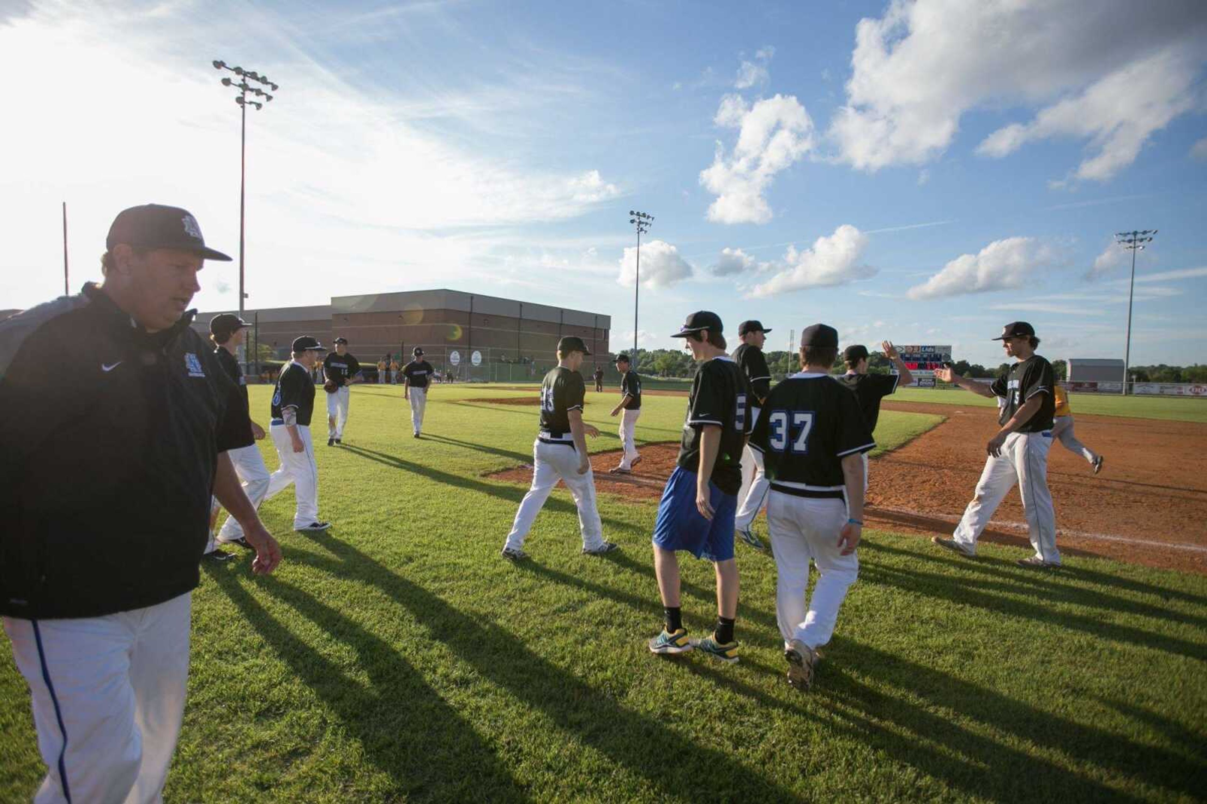 Notre Dame players and coaches celebrate after their 11-0 win over Potosi during a Class 4 sectional Tuesday, May 26, 2015 at Notre Dame Regional High School. (Glenn Landberg)