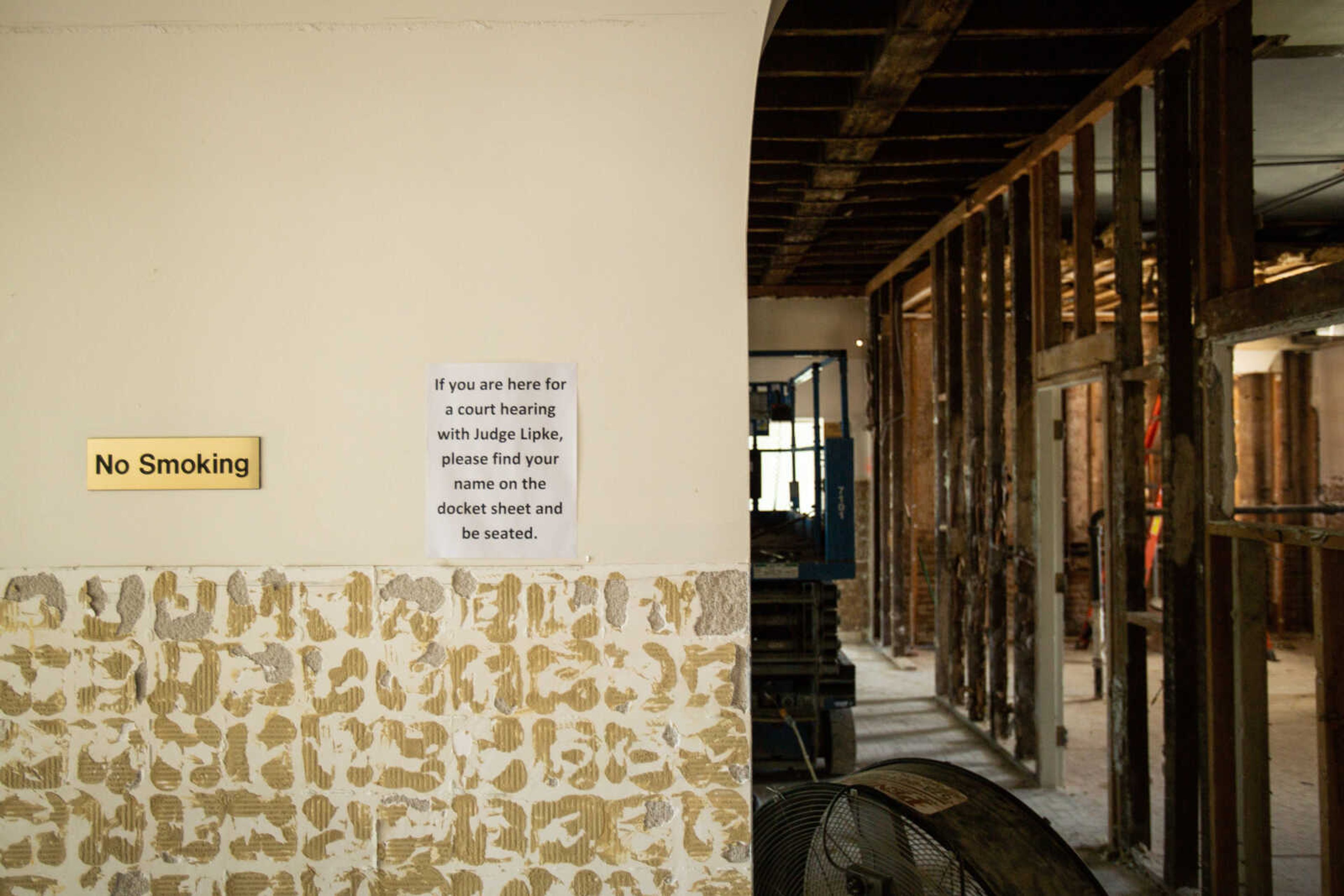 Signage remains on the wall as crews continue the demolition phase of the Common Pleas Courthouse renovation on Tuesday, June 16, 2020.