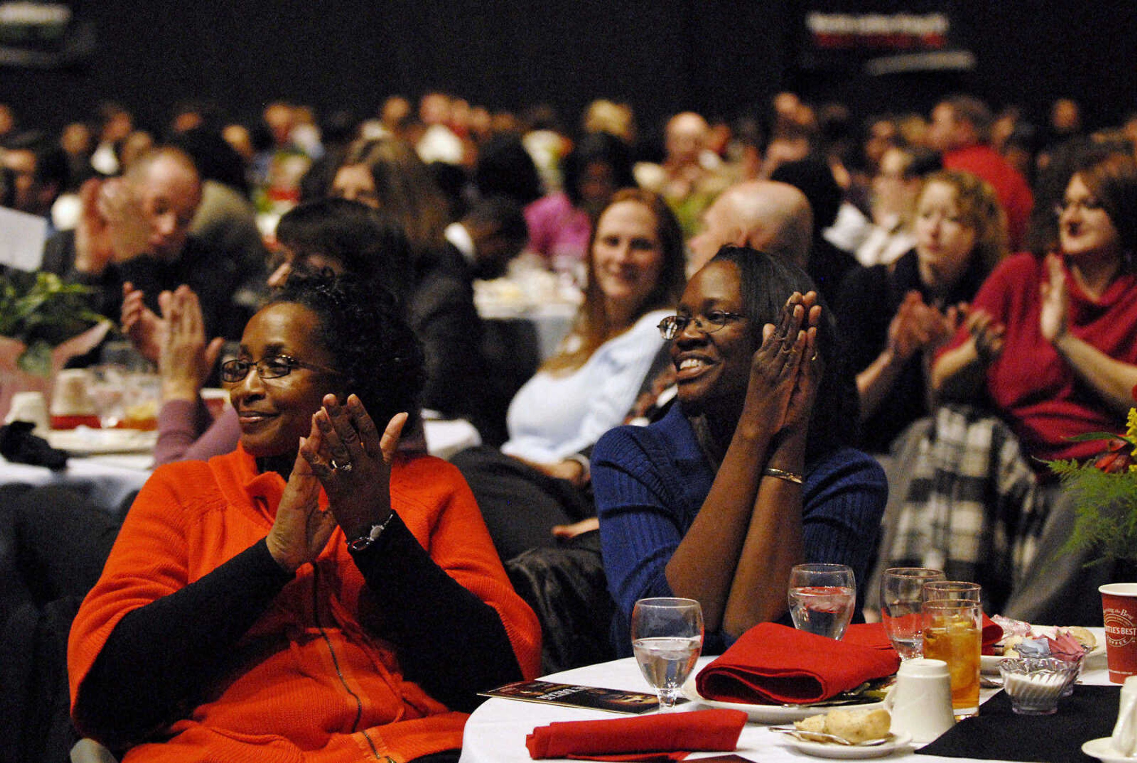 KRISTIN EBERTS ~ keberts@semissourian.com

Cynthia Paul, left, and Teressa Johnson applaud during the "Living the Spirit of the Dream" 2011 Dr. Martin Luther King, Jr. Celebration Dinner at the Show Me Center on Wednesday, Jan. 19.