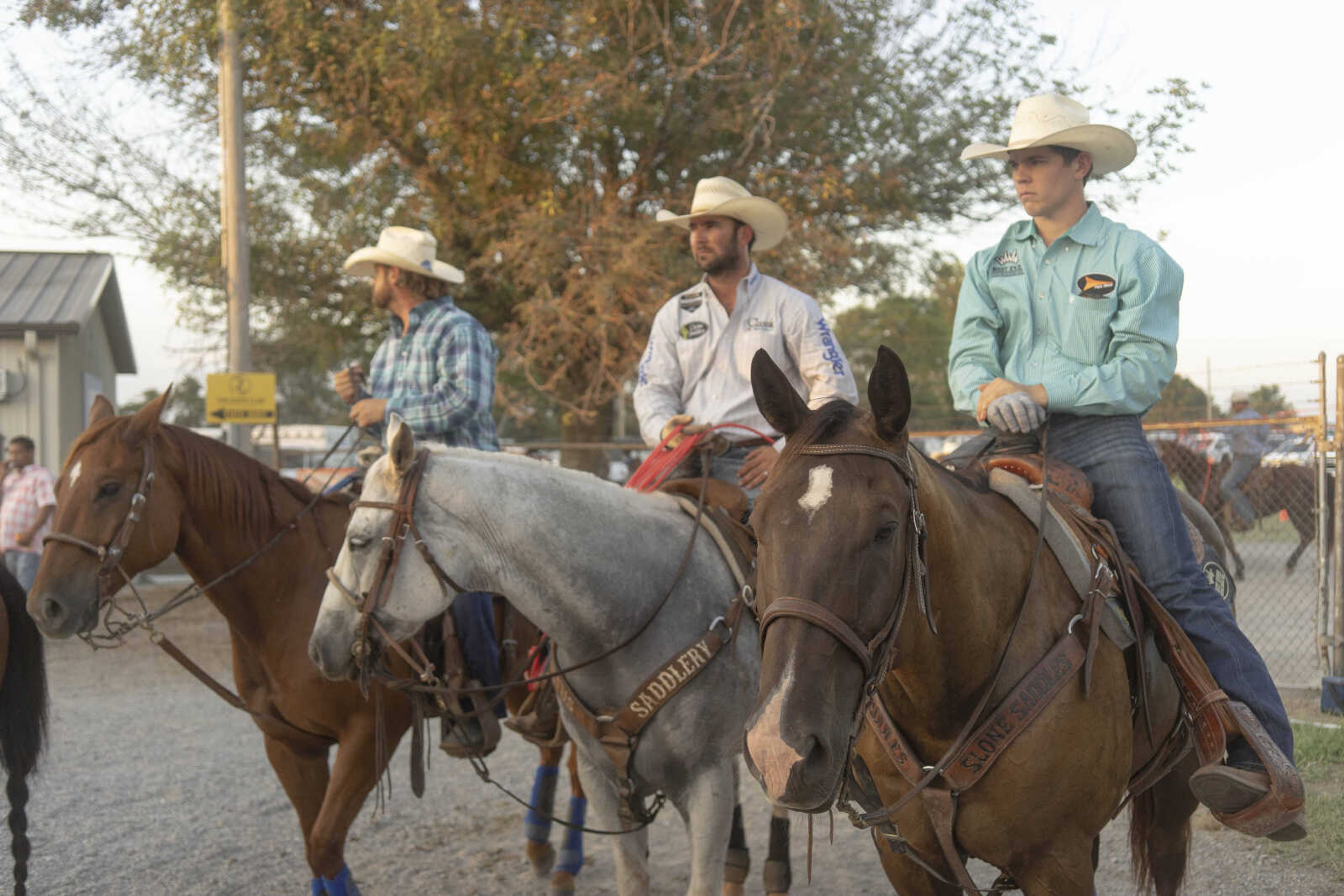 Men watch an event from horseback during the Sikeston Jaycee Bootheel Rodeo on Thursday, Aug. 12, 2021, in Sikeston, Missouri.