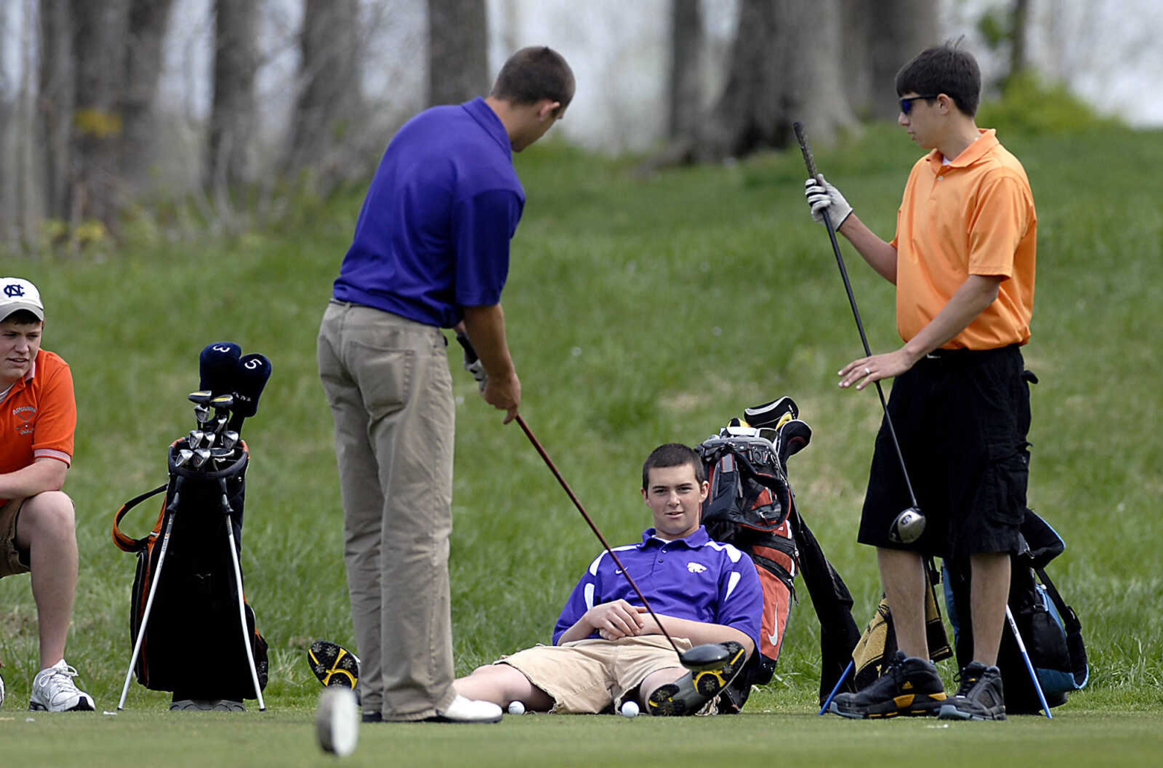 KIT DOYLE ~ kdoyle@semissourian.com
Bloomfield's Blake Cox collects golf balls as his pairing waits to tee off Thursday, April 16, 2009, during the Saxony Lutheran Invitational at Dalhousie Golf Club in Cape Girardeau.