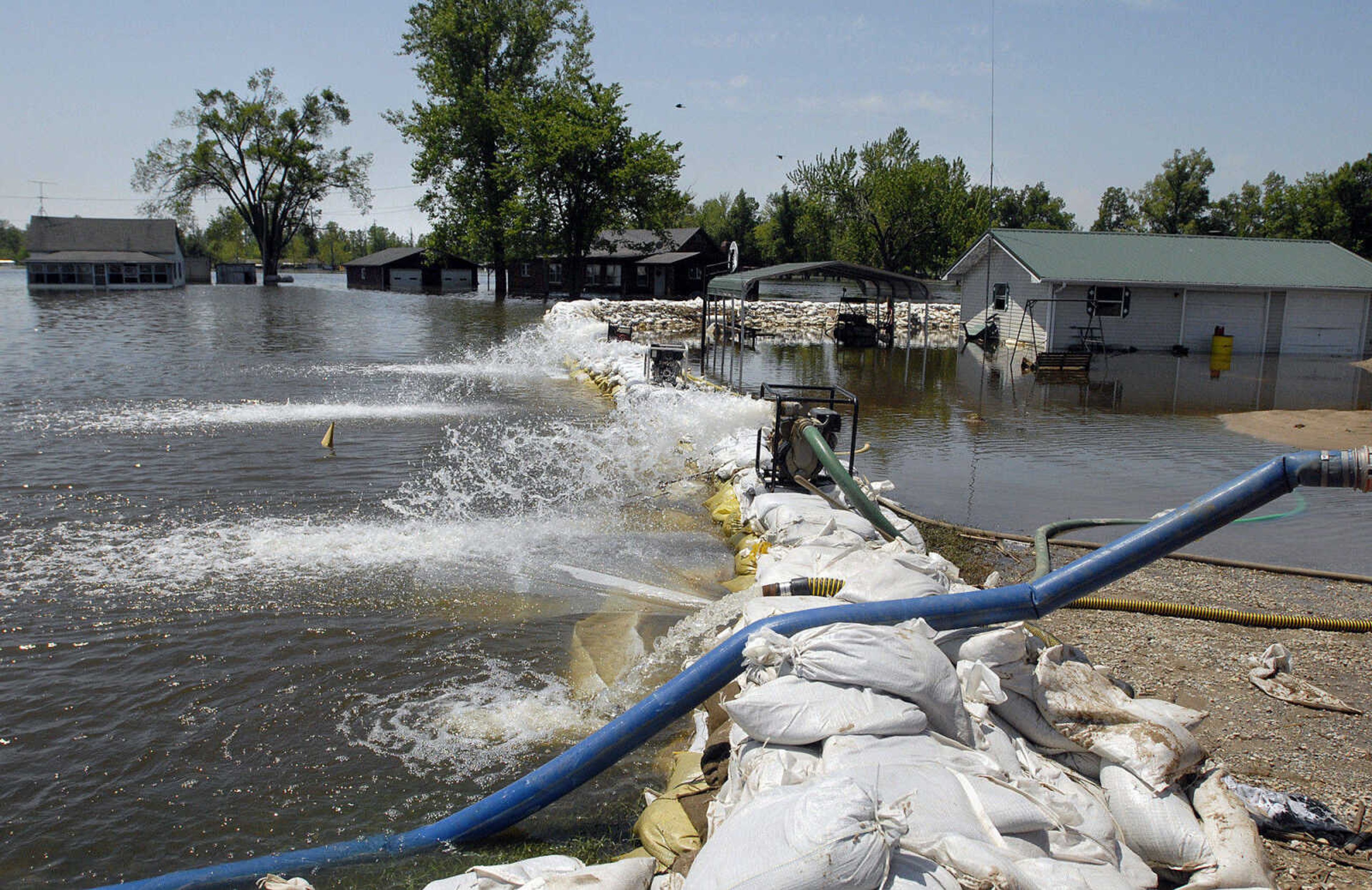 LAURA SIMON~lsimon@semissourian.com
Floodwaters are pumped from a house along Illinois Route 3 in Olive Branch Thursday, May 5, 2011.