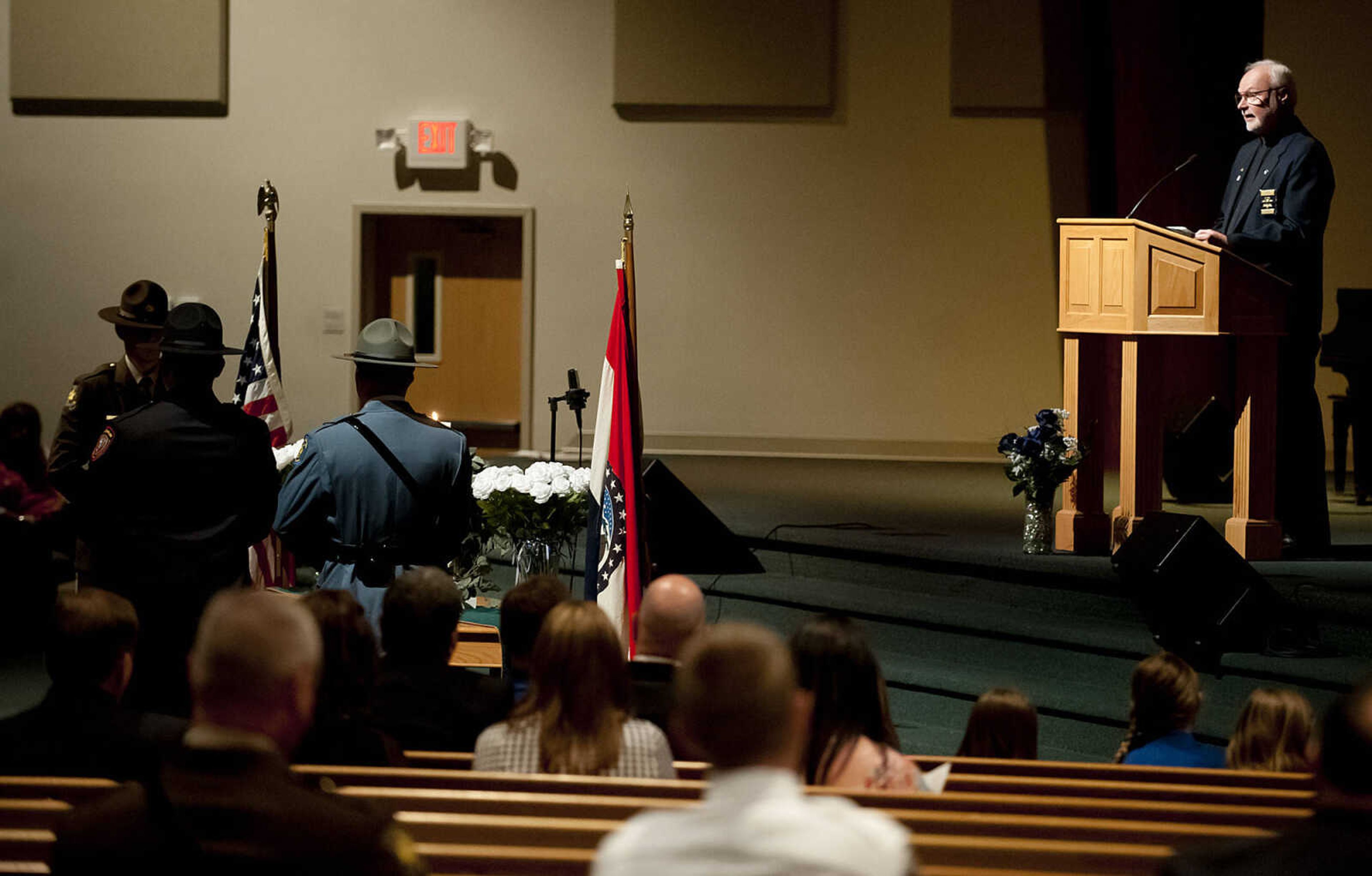 Chaplain Father John Harth reads the names of the 48 Southeast Missouri law enforcement officers that have died in the line of duty since 1875 during the Senior and Lawmen Together Law Enforcement Memorial Friday, May 9, at the Cape Bible Chapel.