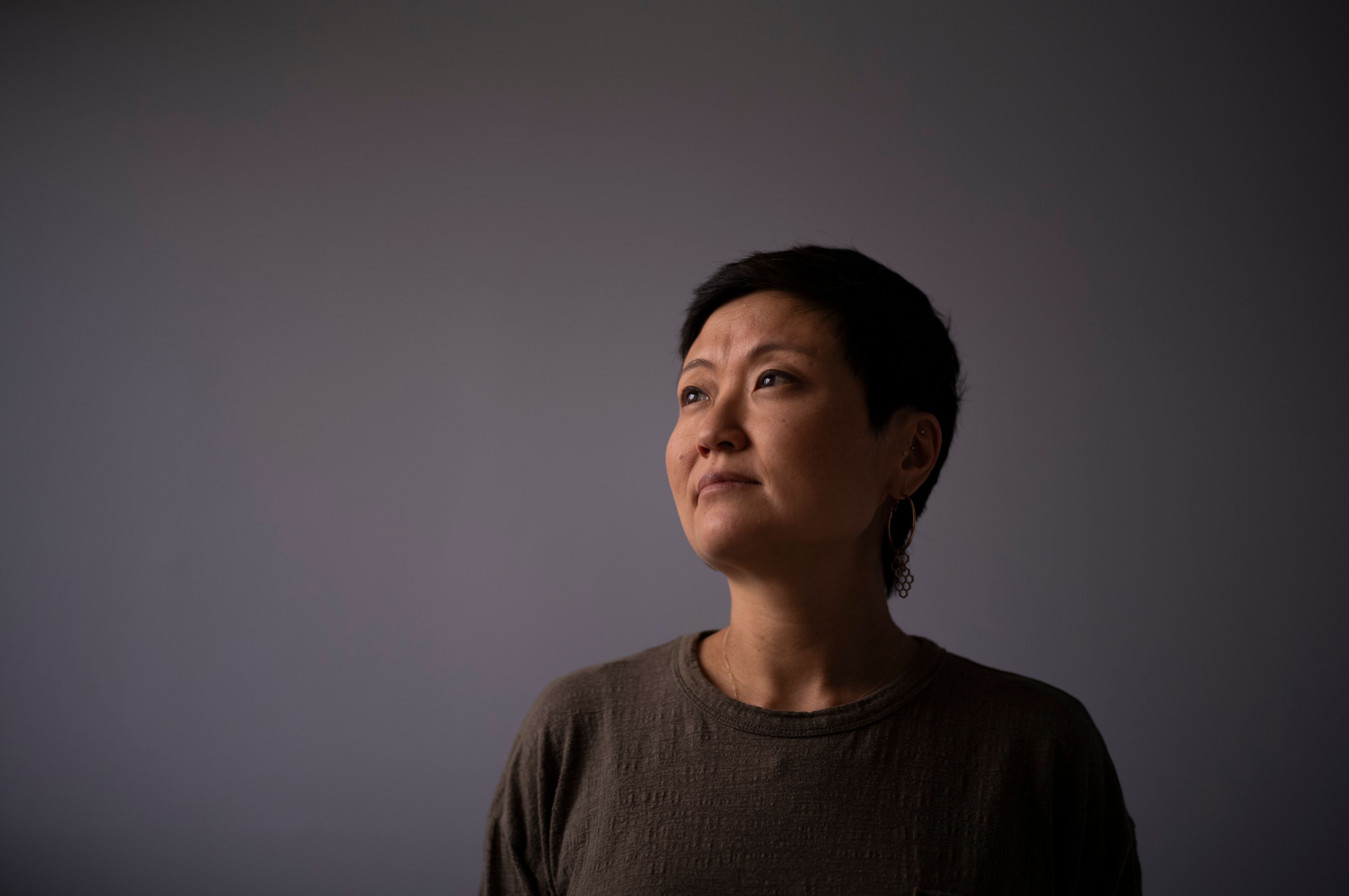 Robyn Joy Park, an adoptee from South Korea, stands for a photo at her home in Pasadena, Calif., Friday, April 19, 2024. (AP Photo/Jae C. Hong)