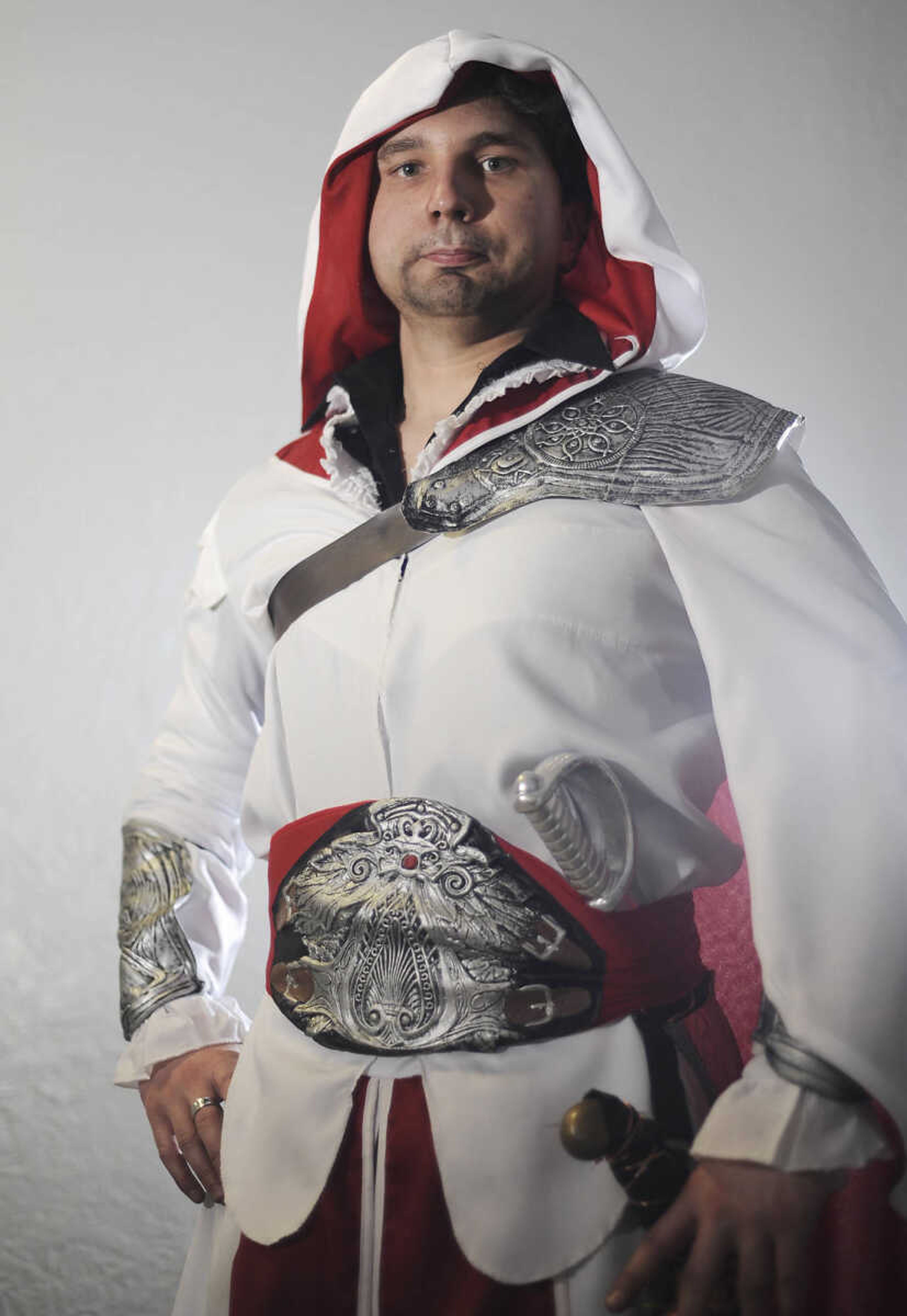 E.J. Norman of Cape Girardeau as Ezio Auditore da Firenze from the Assassins Creed video games at the 2013 Cape Comic Con Saturday, April 20, at the Arena Building in Cape Girardeau. This is the eighth year for the annual event which featured artists, vendors, panel discussions and a costume party Saturdaynight. The three-day event is open Sunday from 11 a.m. to 5 p.m.