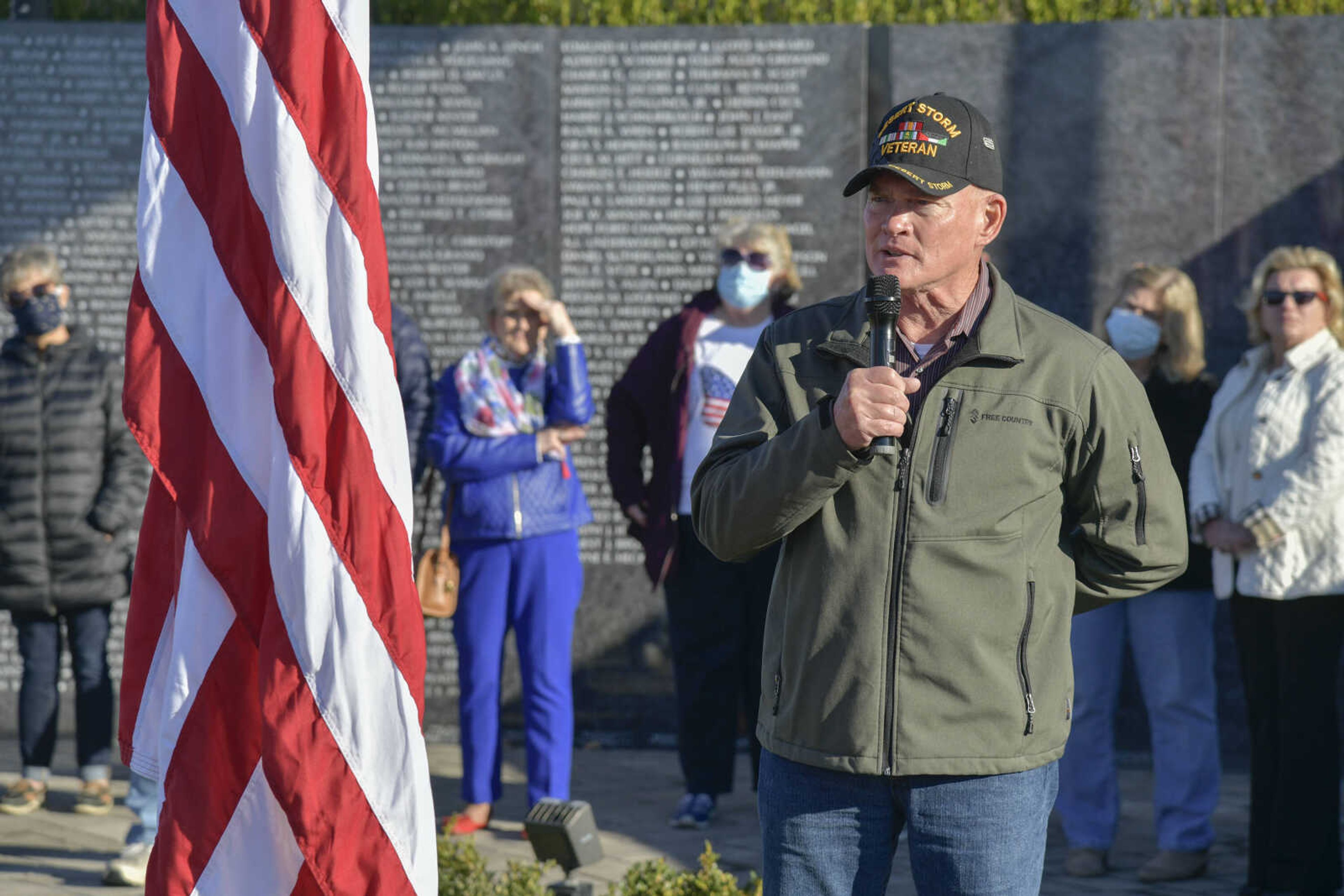 Retired Master Chief of the Navy Seabees, Michael Morgan, speaks about his grandfather and father, WWI veteran Thomas O. Morgan and Korea veteran Richard A. Morgan, during the Veteran's Day flag presentation ceremony at Cape County Park North in Cape Girardeau on Wednesday, Nov. 11, 2020.