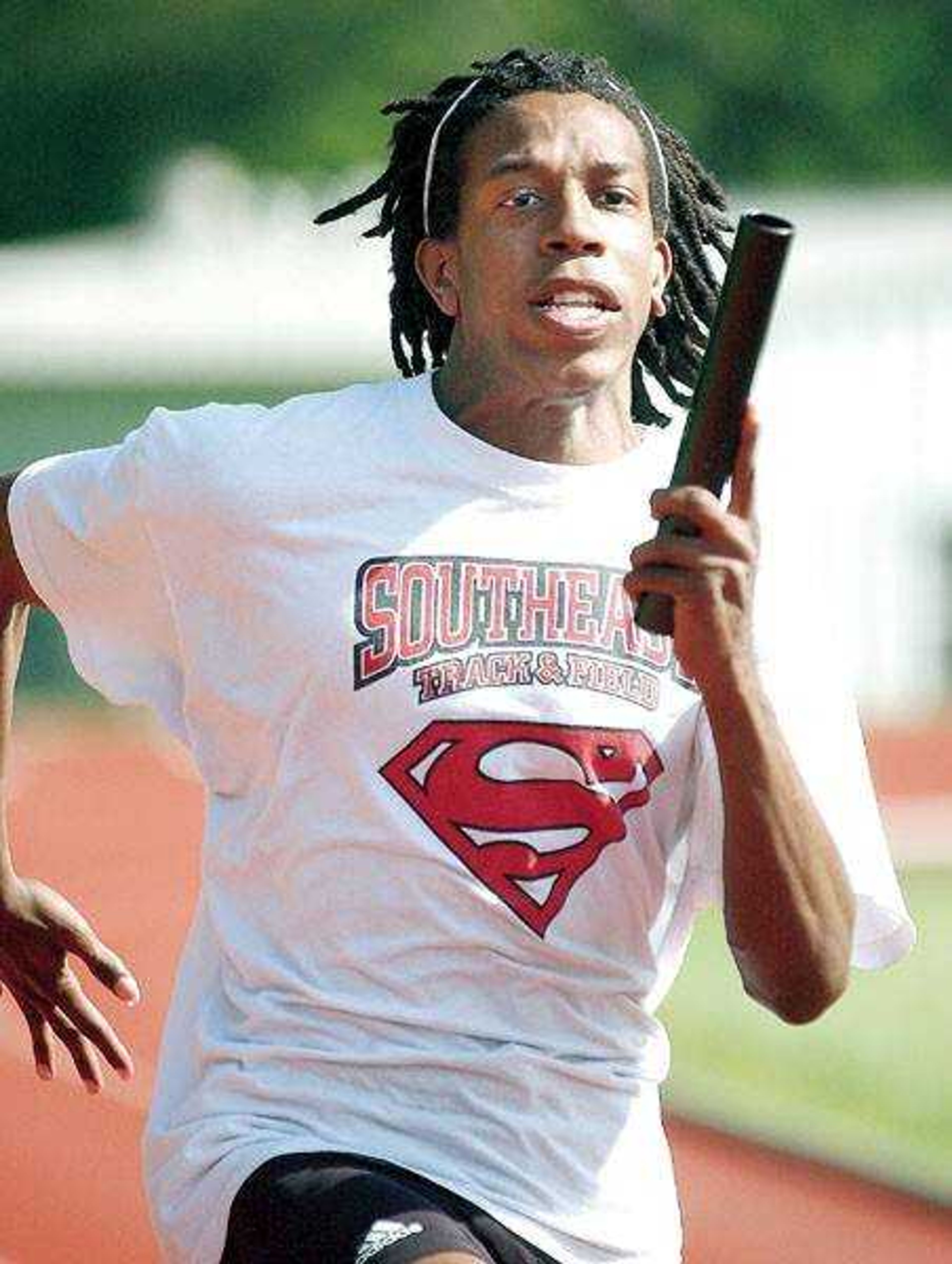 Miles Smith worked on baton passes during track practice.