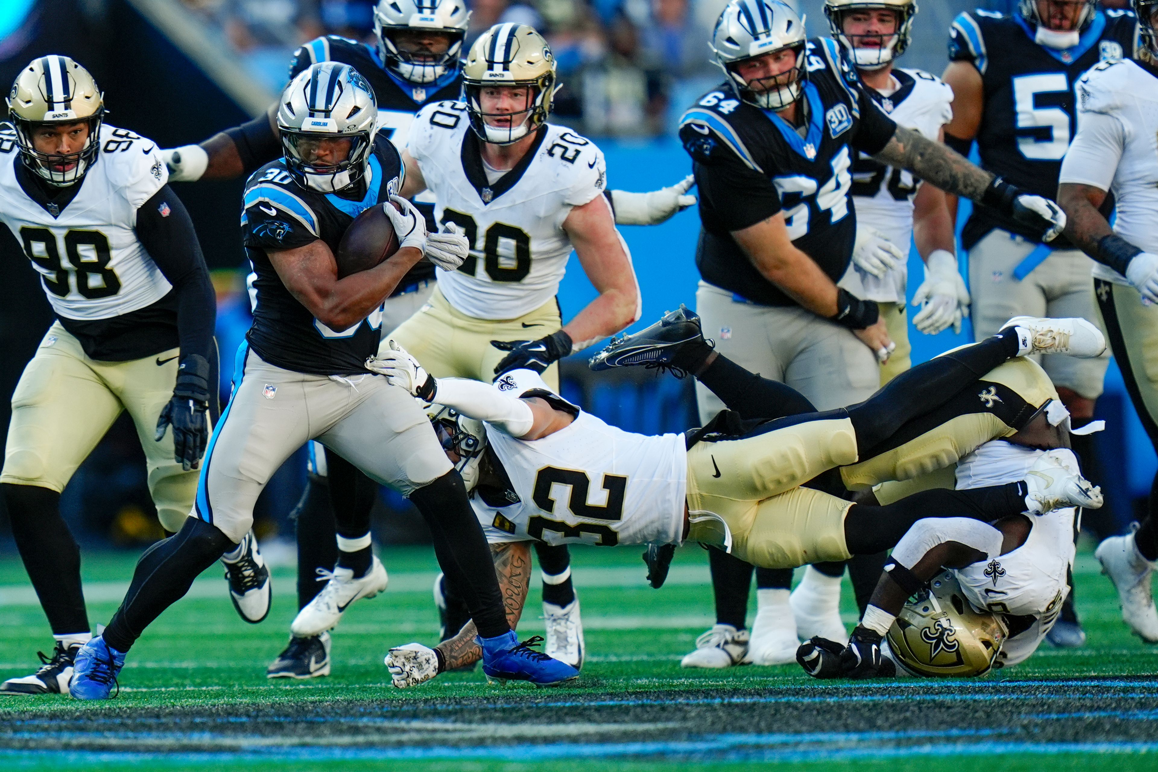 Carolina Panthers running back Chuba Hubbard is tackled by New Orleans Saints safety Tyrann Mathieu during the second half of an NFL football game Sunday, Nov. 3, 2024, in Charlotte, N.C. (AP Photo/Rusty Jones)