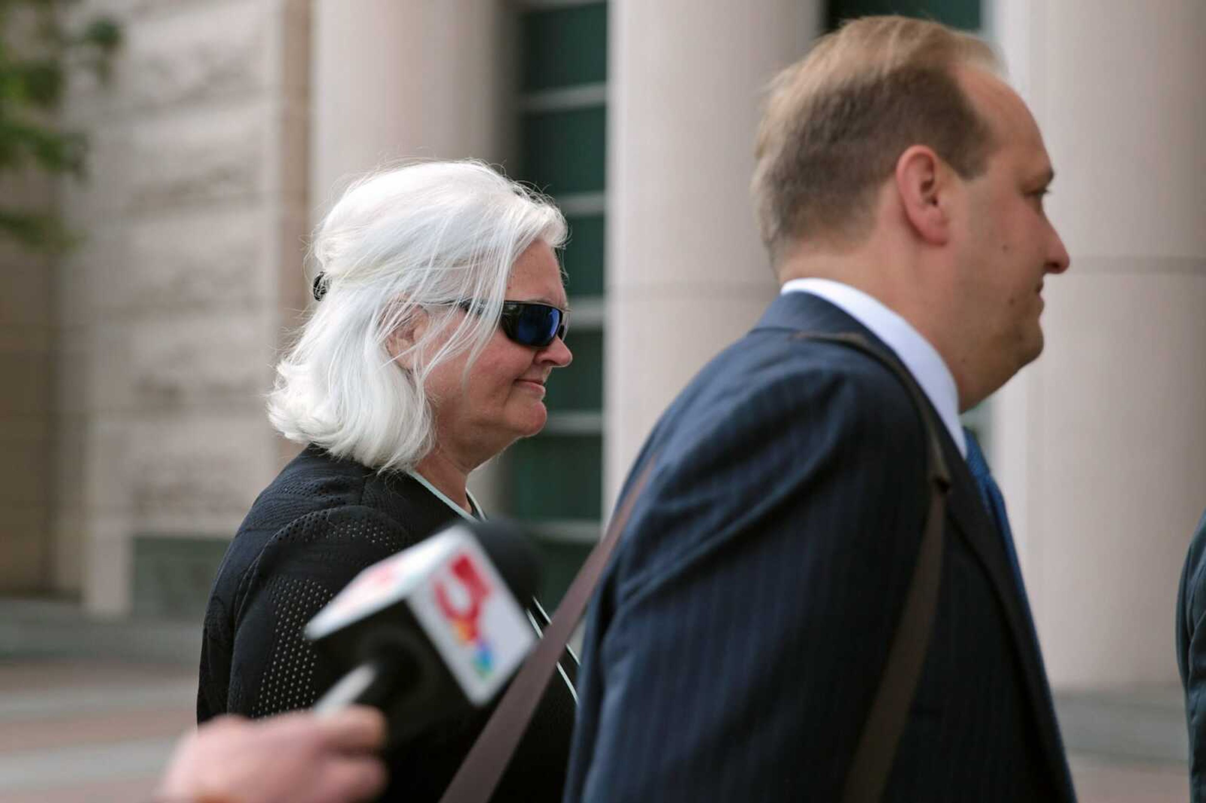 Sheila Sweeney, left, the former CEO of the St. Louis Economic Development Partnership, arrives at the Thomas F. Eagleton U.S. Courthouse on Friday in downtown St. Louis.