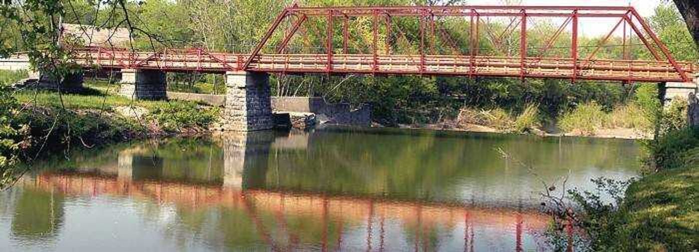 The restored Old Appleton bridge was reflected in Apple Creek.