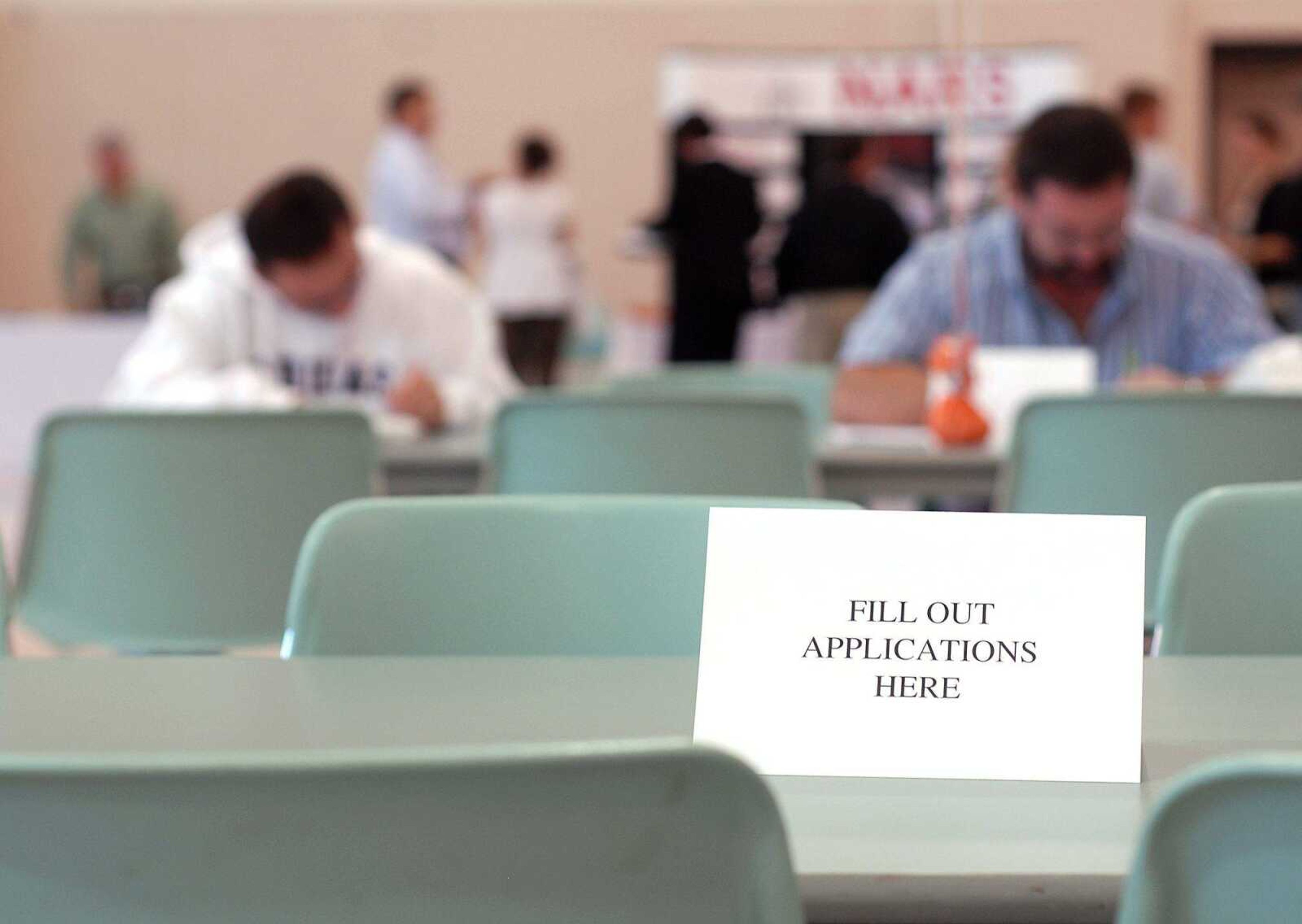 AARON EISENHAUER ~ aeisenhauer@semissourian.com
Attendees fill out applications for prospective employers at the career fair Tuesday at the Osage Centre.