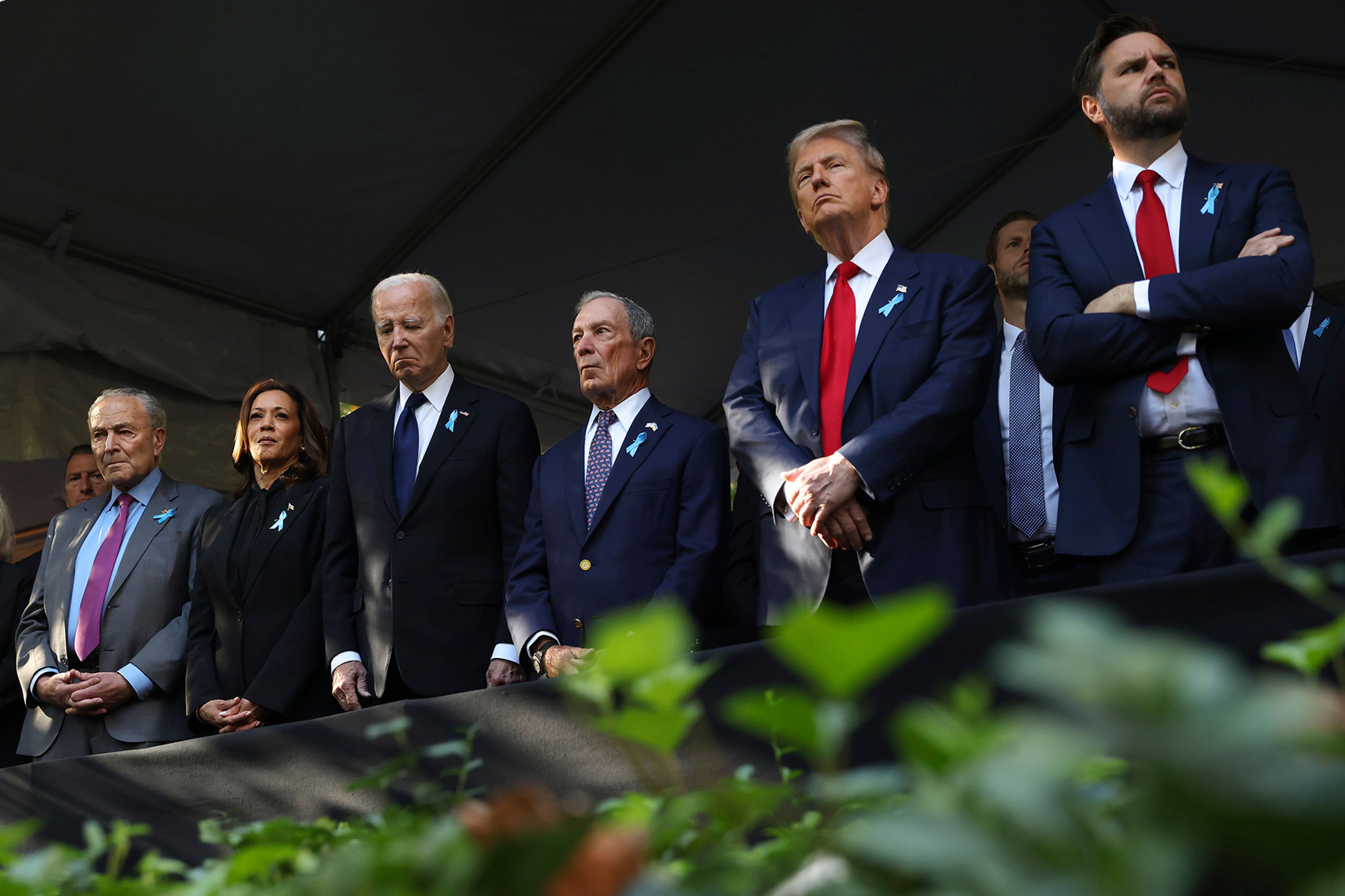 From left, Sen. Chuck Schumer, D-NY, Democratic presidential nominee Vice President Kamala Harris, President Joe Biden, Michael Bloomberg, Republican presidential nominee former President Donald Trump and Republican vice presidential nominee Sen. JD Vance, R-Ohio, attend the 9/11 Memorial ceremony on the 23rd anniversary of the Sept. 11, 2001 attacks, Wednesday, Sept. 11, 2024, in New York.