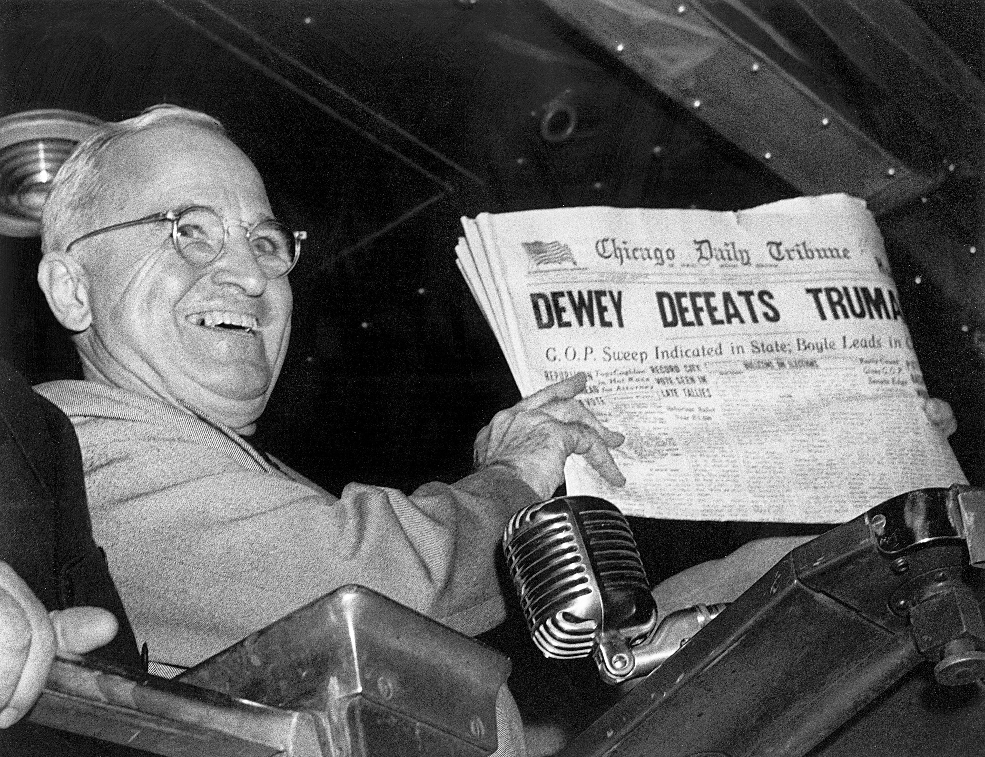 In this Nov. 4, 1948, file photo, President Harry S. Truman at St. Louis' Union Station holds up an election day edition of the Chicago Daily Tribune, which - based on early results - mistakenly announced "Dewey Defeats Truman." 