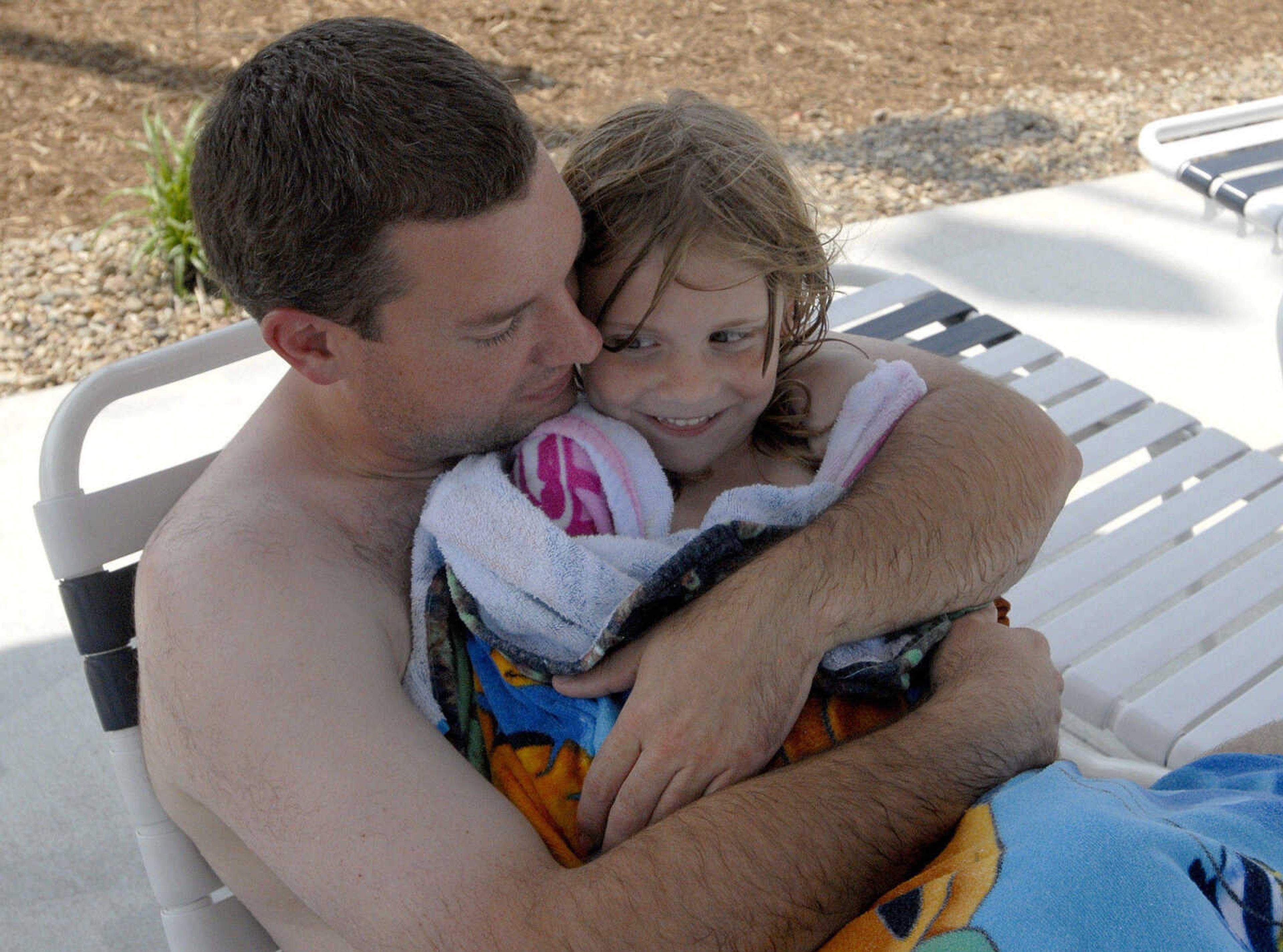 LAURA SIMON~lsimon@semissourian.com
Blaine and Addie Brunkhorst dry off Saturday, May 28, 2011 during opening day of Cape Splash Family Aquatic Center in Cape Girardeau.