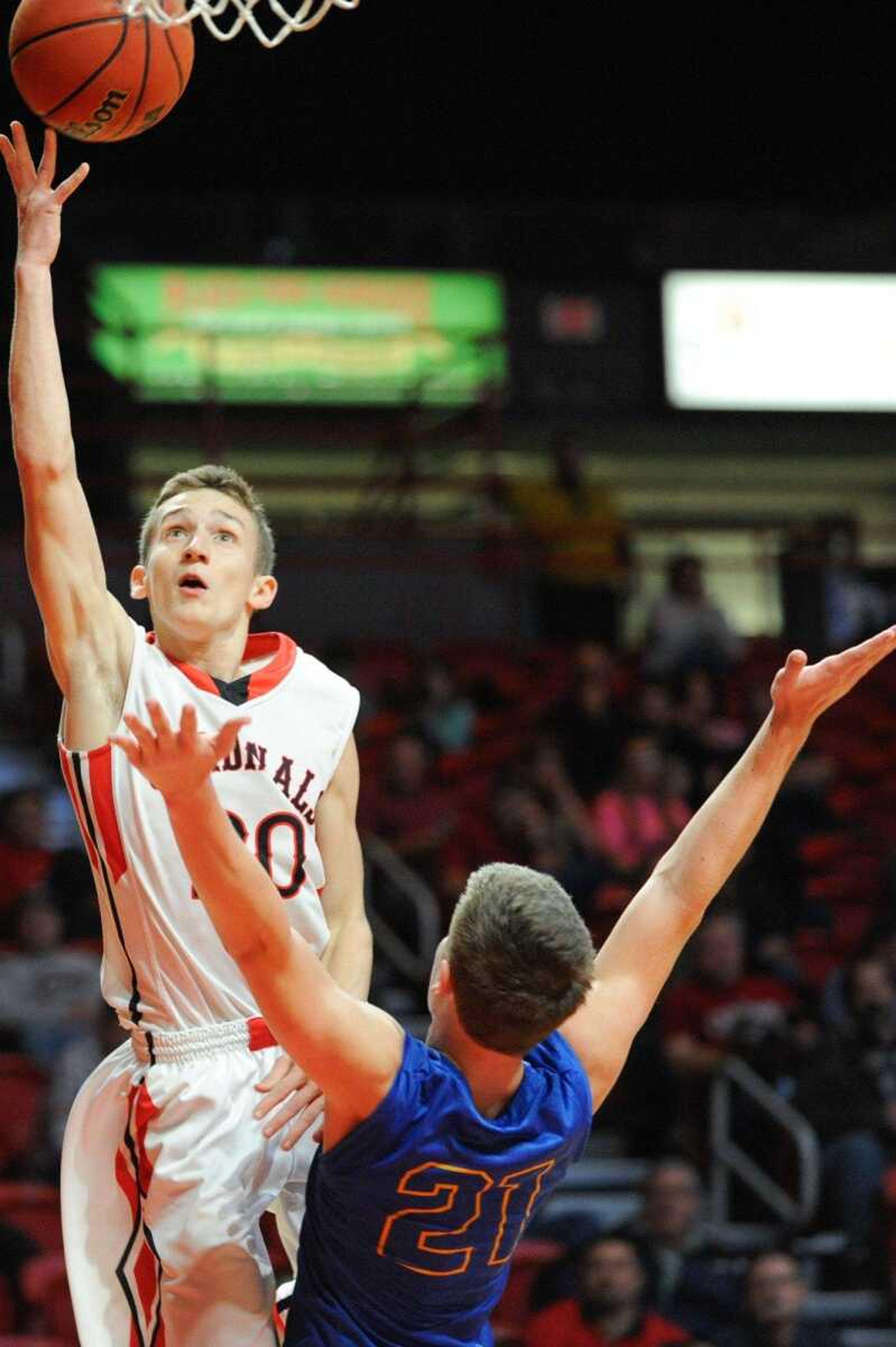 Woodland's Cole Schlief puts up a shot past Oran's Cole Priggel during the first quarter in a first-round game of the Southeast Missourian Christmas Tournament on Saturday at the Show Me Center. (Glenn Landberg)