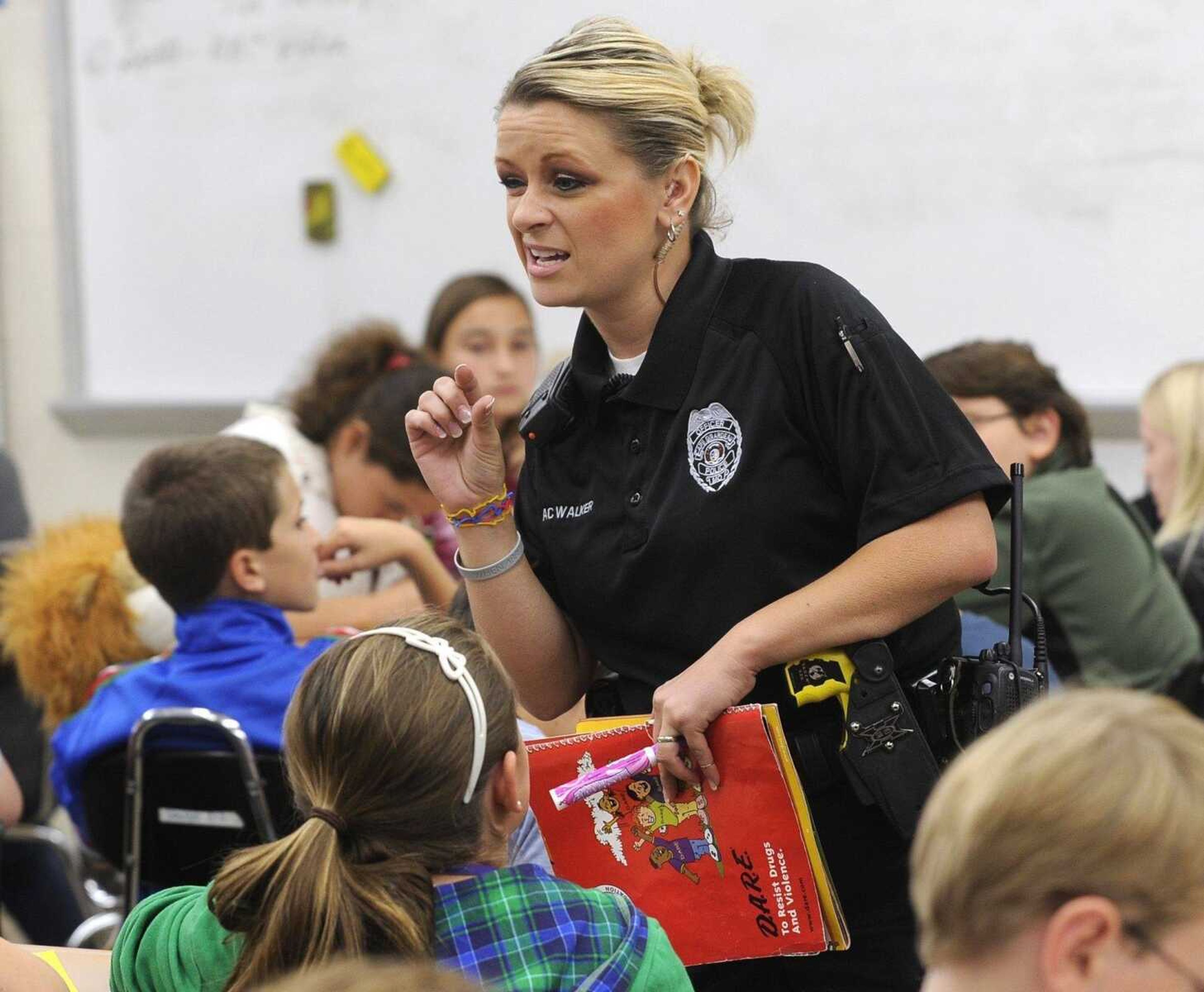 Cape Girardeau police officer A.C. Walker discusses the dangers of alcohol with the students in her DARE class Oct. 12, 2010 at Central Middle School. (Fred Lynch)