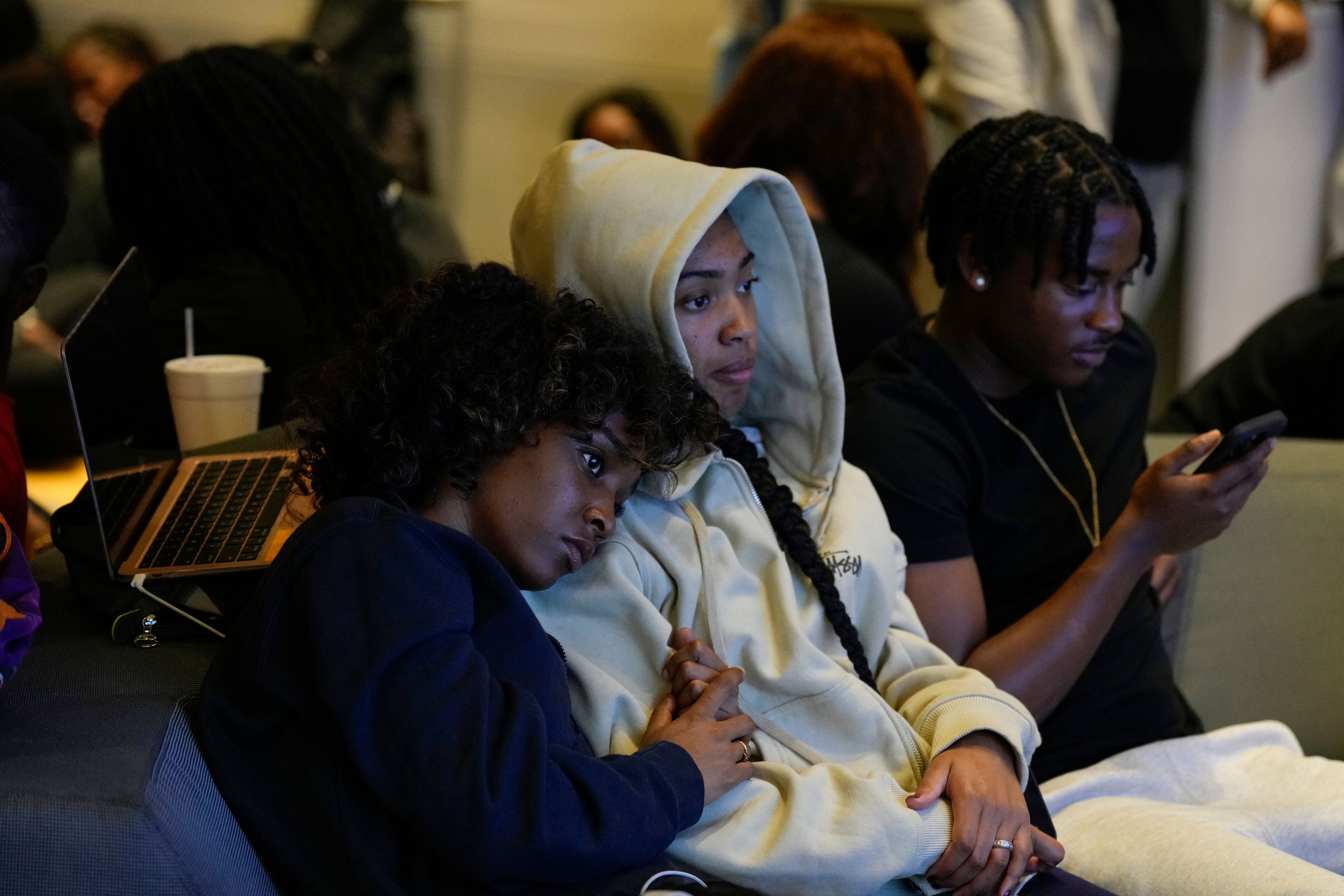 Leah Charles, left, and Tianna Adams, North Carolina A&T students, gathers with other students for an election night watch party, Tuesday, Nov. 5, 2024, in Greensboro, N.C. (AP Photo/George Walker IV)