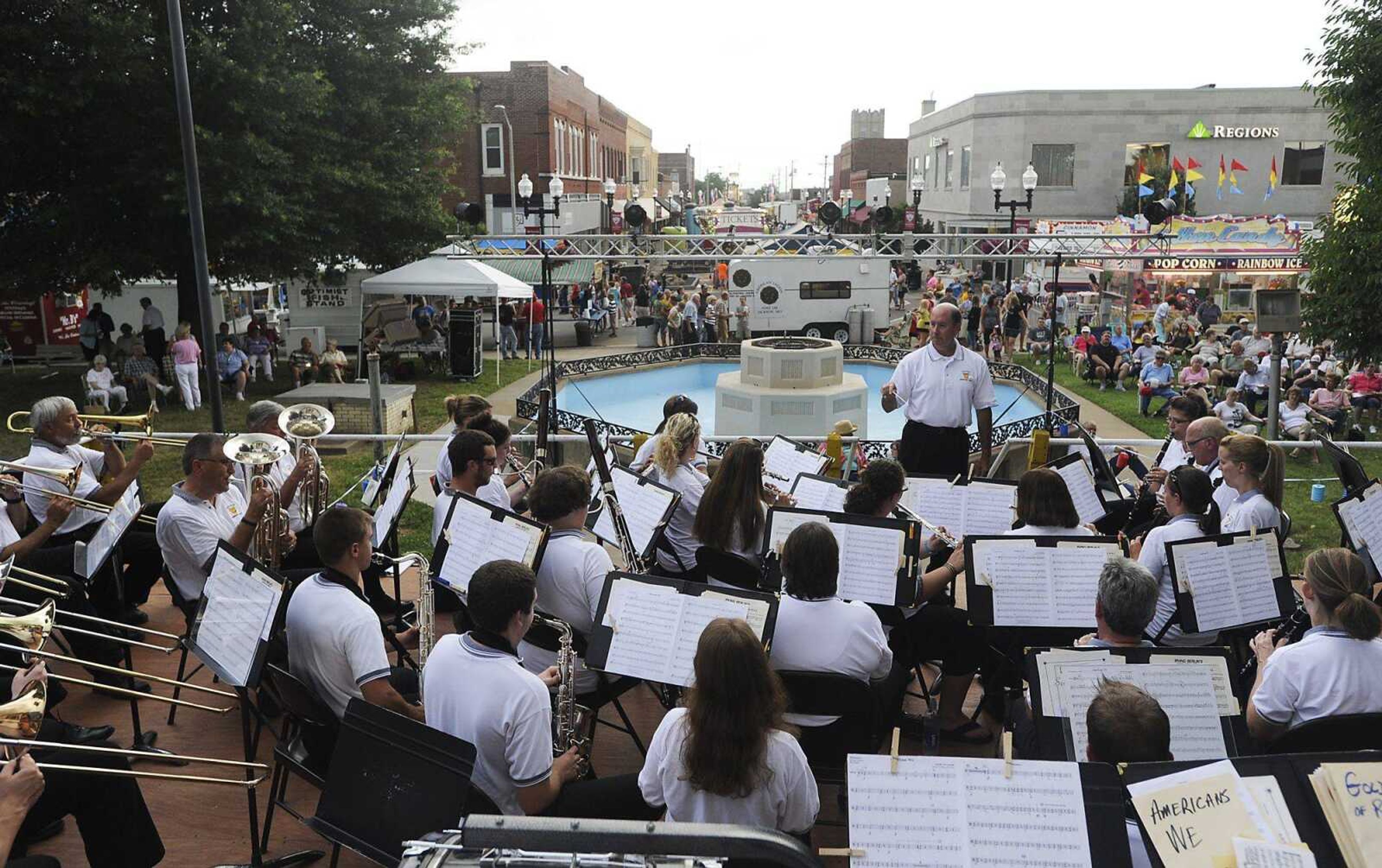 The Jackson Municipal Band performs during the 105th Jackson Homecomers celebration Tuesday on the lawn of the Cape Girardeau County Courthouse in Jackson. A severe thunderstorm moved through Jackson a short time later, causing outdoor performances to be canceled and the carnival to be shut down. More photos are in a gallery at semissourian.com. (Adam Vogler)