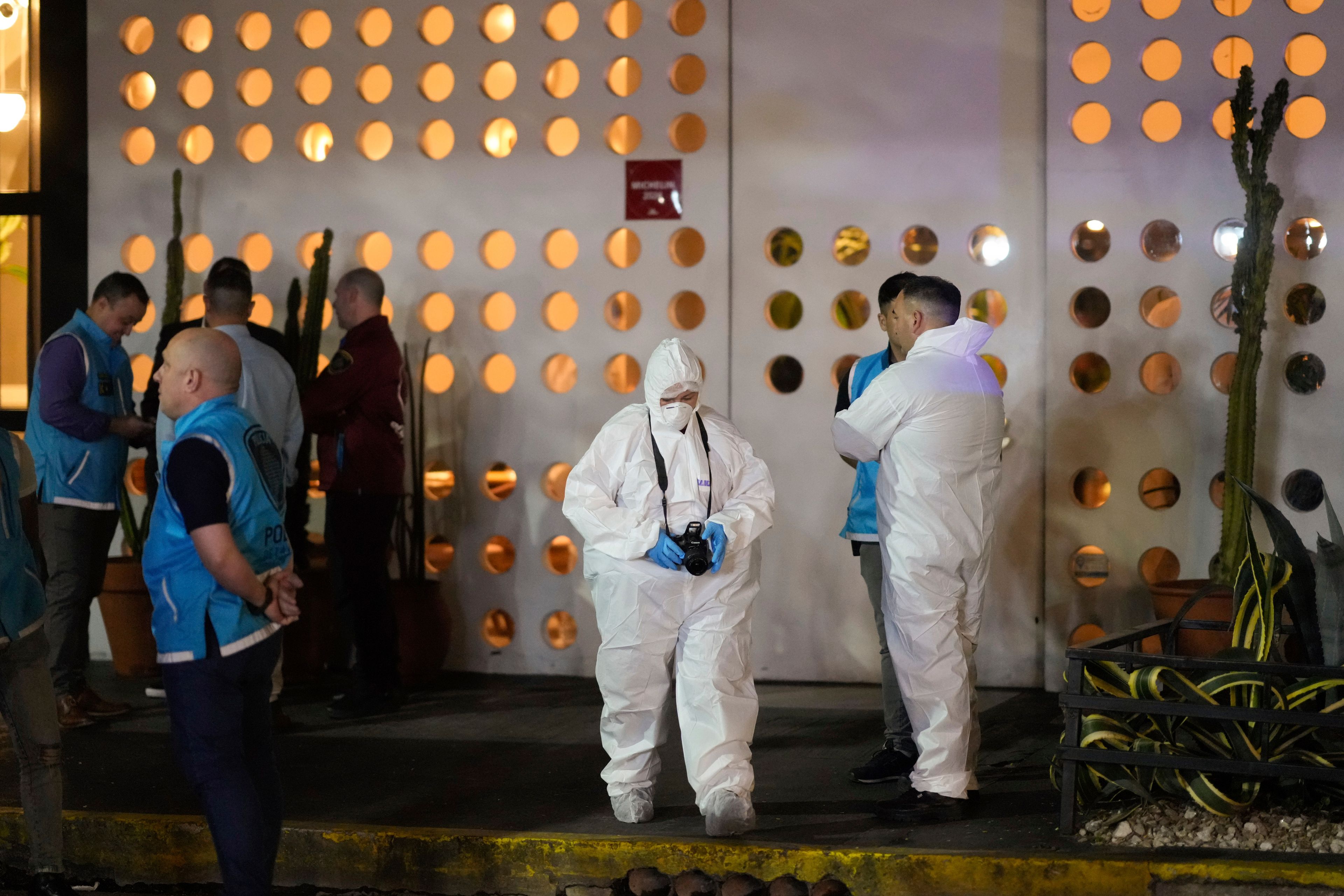 Forensic investigators exit the hotel where former One Direction singer Liam Payne was found dead after he fell from a balcony in Buenos Aires, Argentina, Wednesday, Oct. 16, 2024. (AP Photo/Natacha Pisarenko)