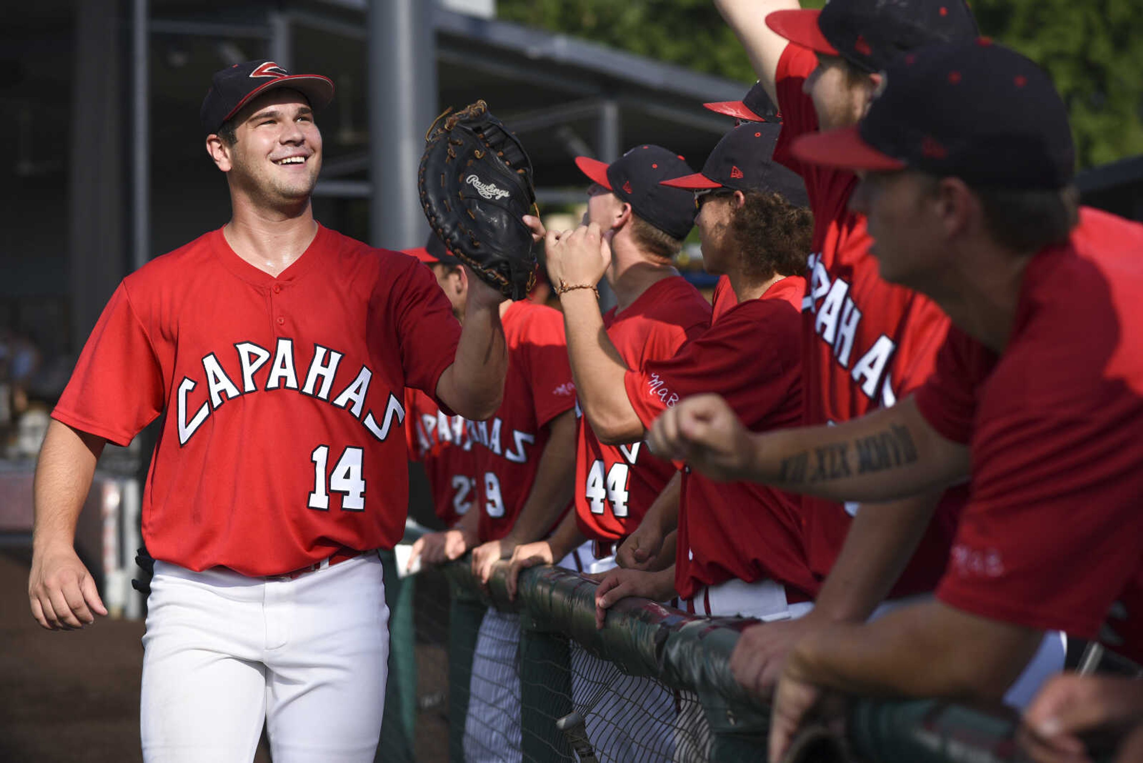 Cape Girardeau Capahas pitcher Drew Reischman high fives his teammates before the start of a doubleheader against the Charleston Riverdogs on Sunday, July 21, 2019, at Capaha Field in Cape Girardeau.