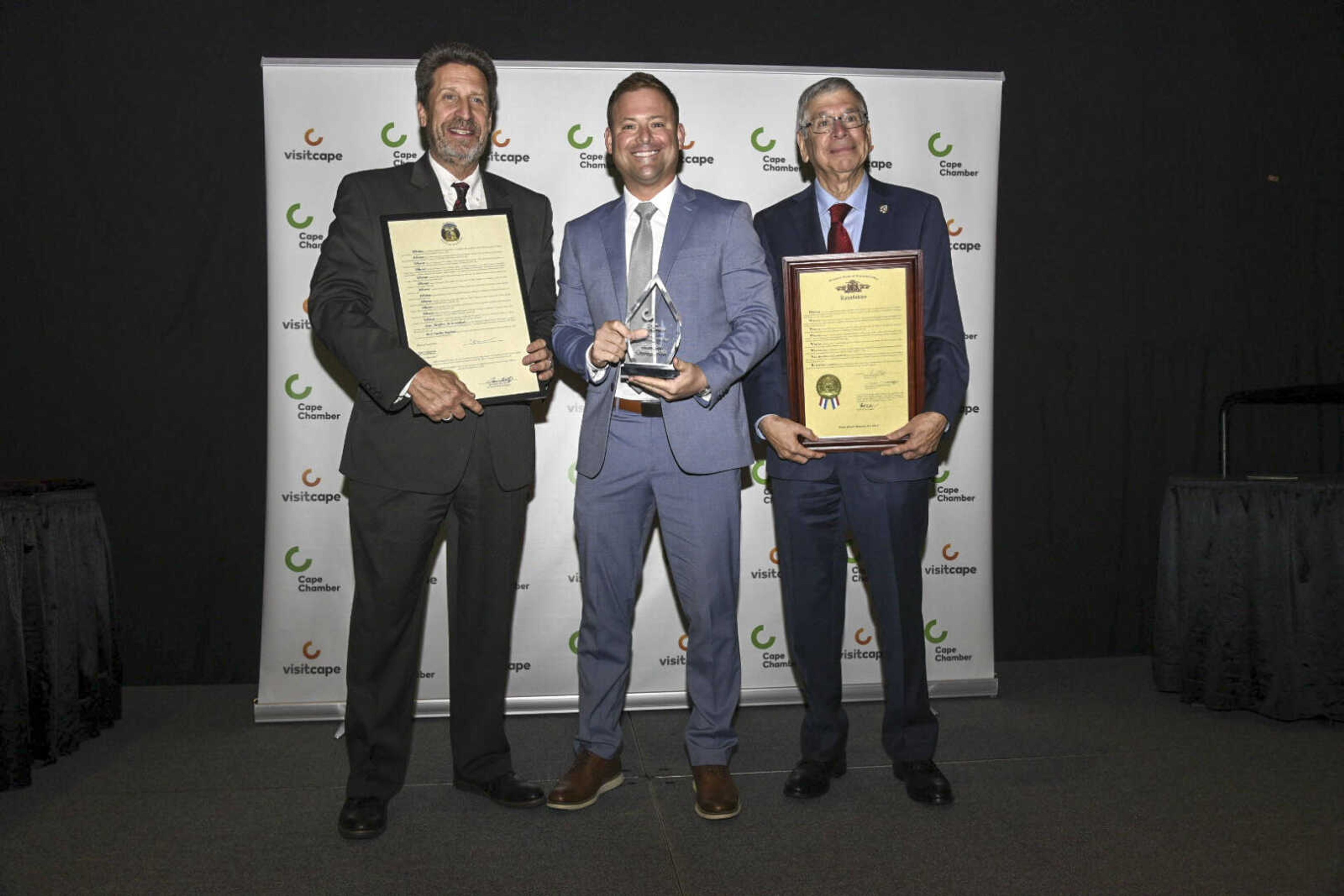 A representative from Hudson Chiropractic accepts the Small Business of the Year Award during the 2021 Annual Cape Chamber Dinner Thursday, Oct. 21, at the Show Me Center in Cape Girardeau.