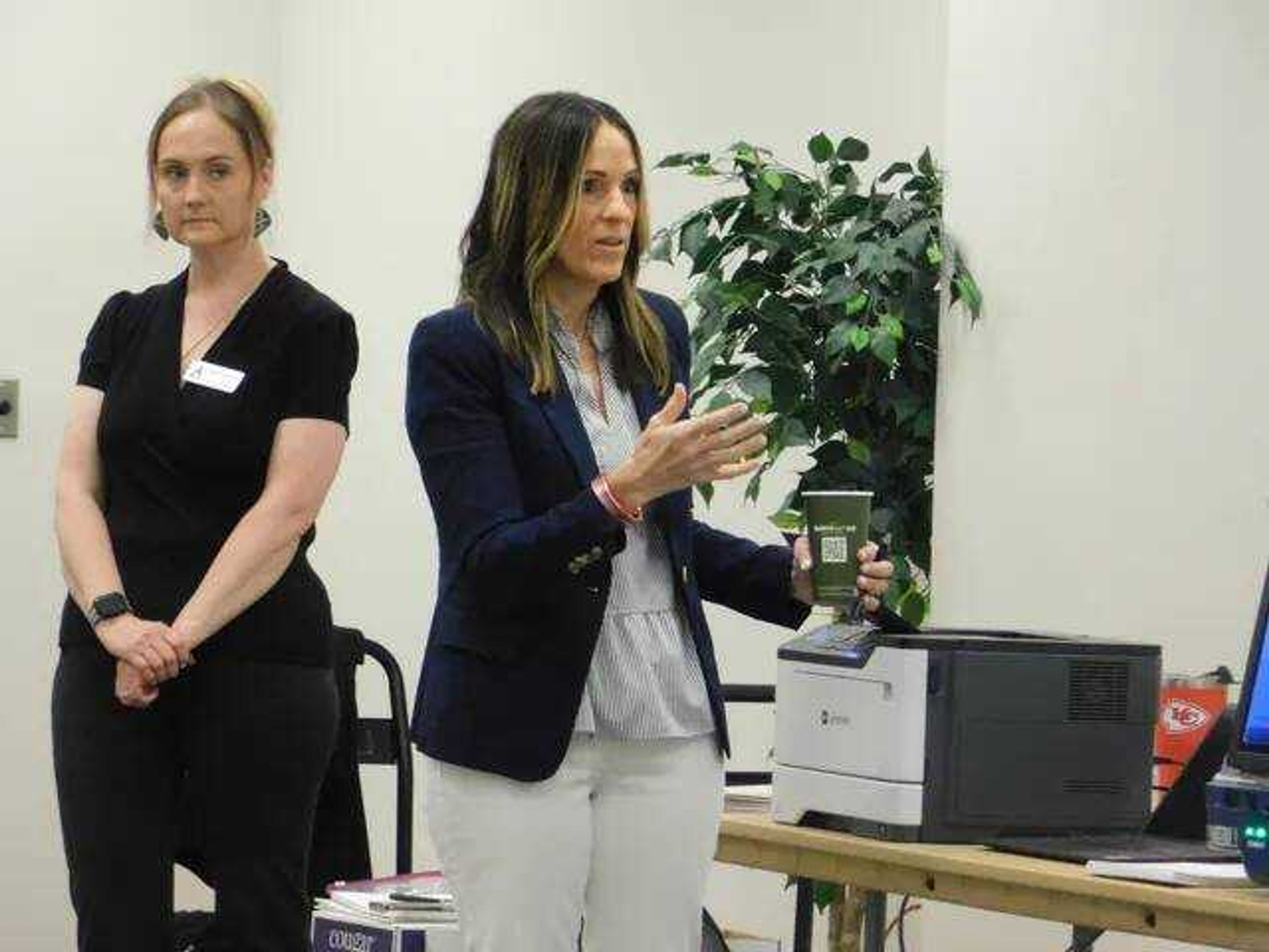 Cape Girardeau County Clerk Kara Clark Summers (right) discusses election night ballot security during a public voting machine demonstration at Cape Girardeau's Osage Centre on Friday, May 10, 2024. The election system seen here, the Unisyn OpenElect Voting System 2.2, was ultimately chosen to be the county's voting system for ideally the next decade or more.