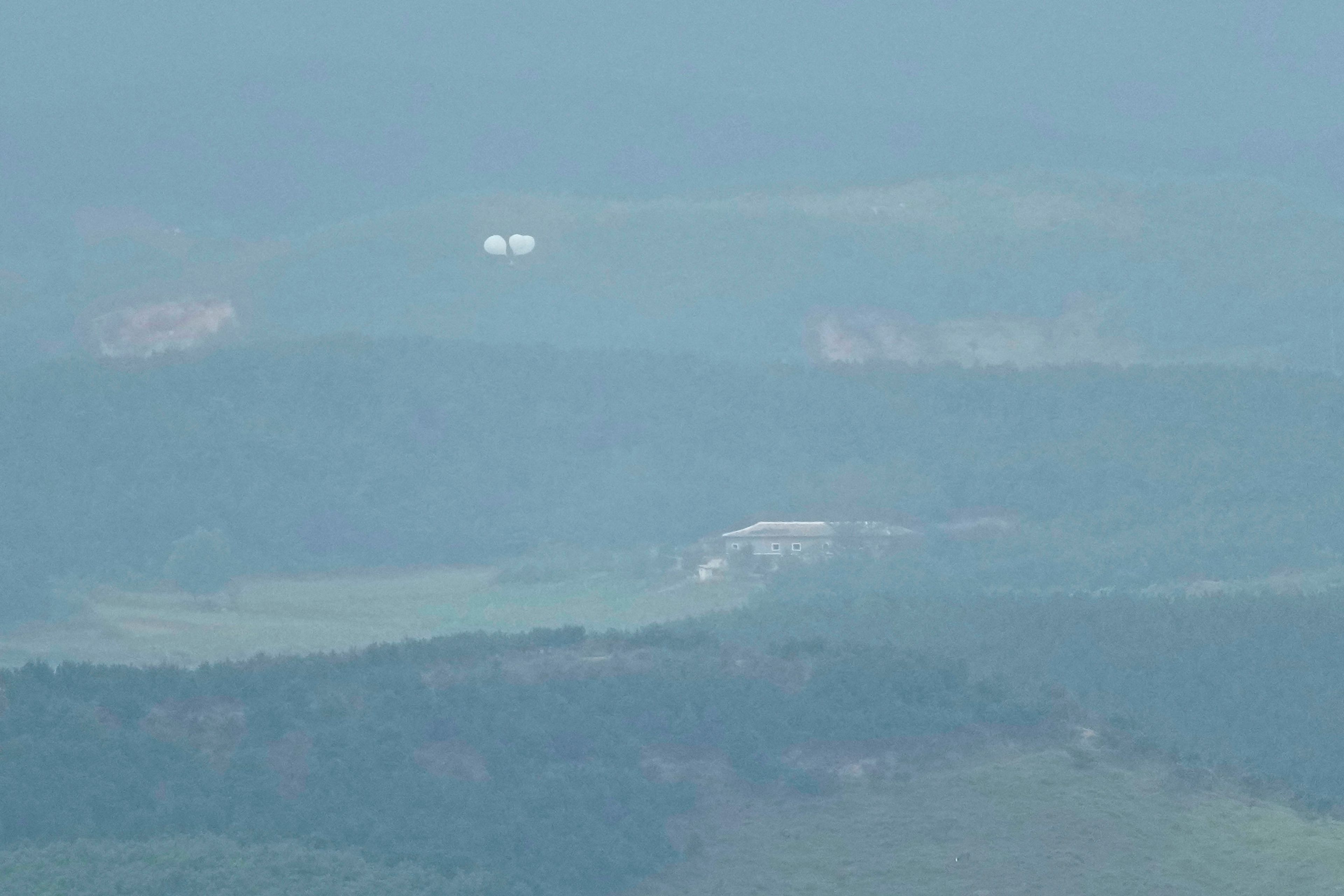 Balloons are seen from the Unification Observation Post in Paju, South Korea, near the border with North Korea, Thursday, Sept. 5, 2024. (AP Photo/Lee Jin-man)