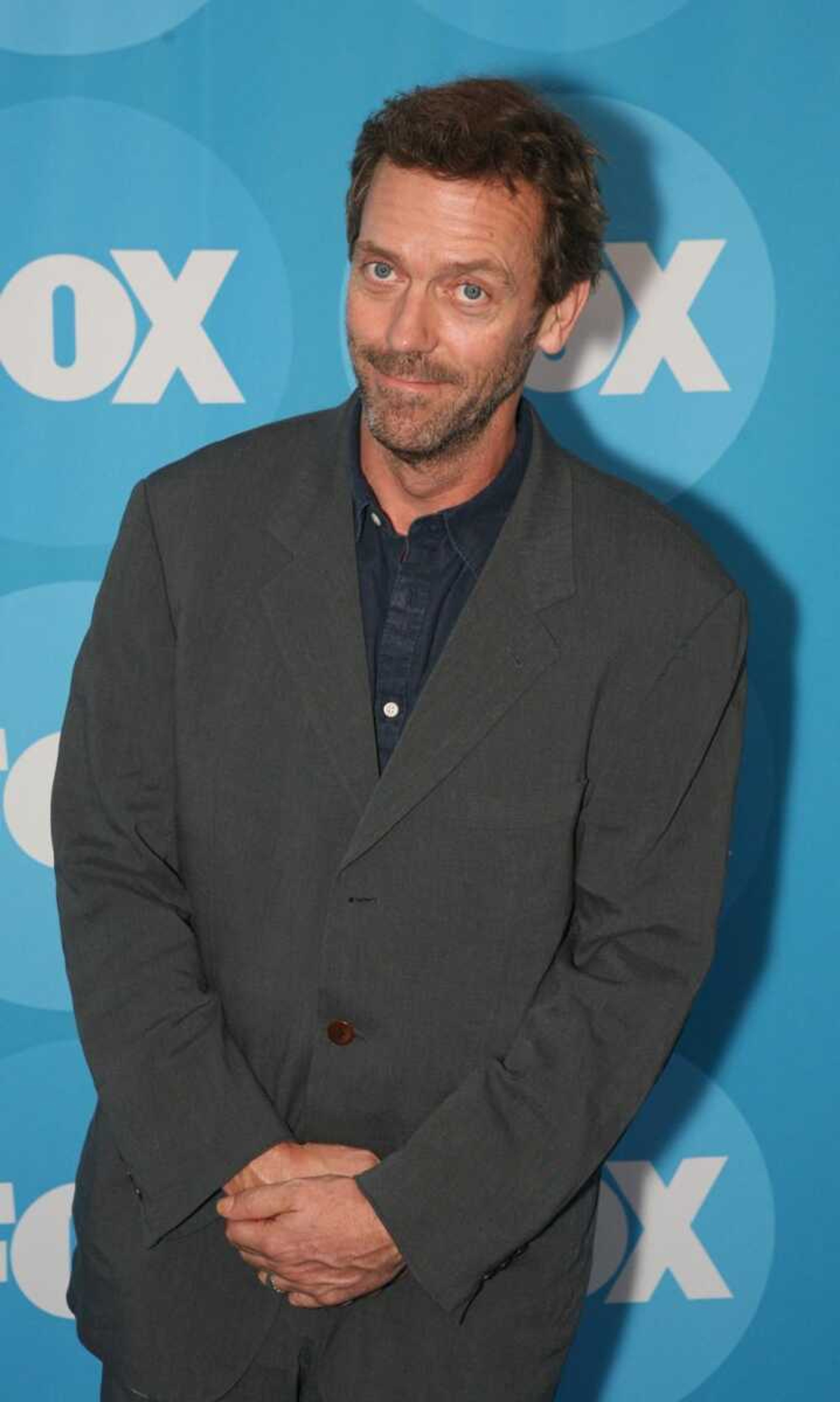 Hugh Laurie of the Fox series "House" was made a member of the Order of the British Empire on Wednesday. Queen Elizabeth II presented the honor to Laurie at Buckingham Palace. (RENE MACURA ~ Associated Press)