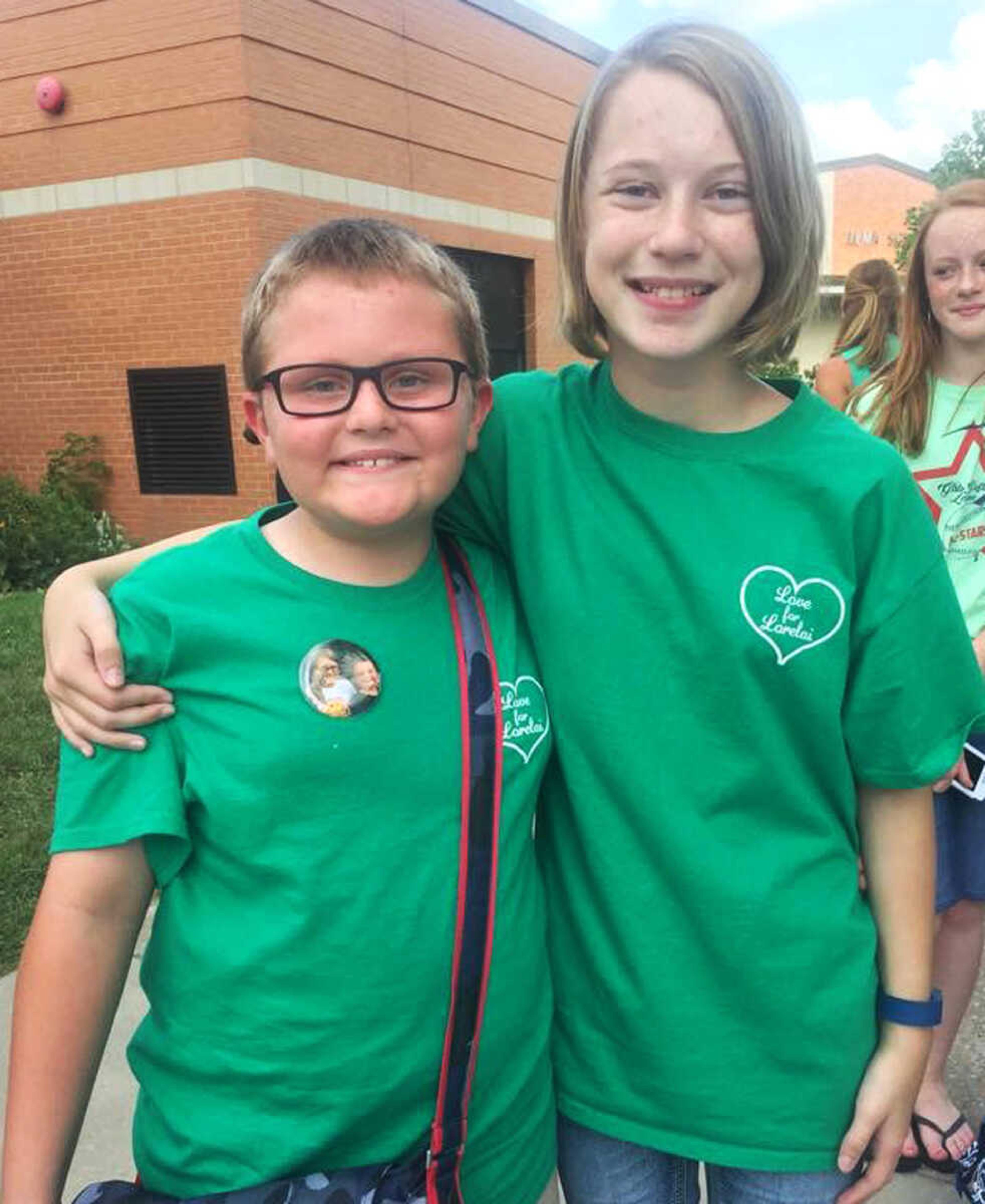 Community members wear green Tuesday, Aug. 18, 2015 to support Lorelai Clubb, a 12-year-old seventh grader who was diagnosed with Acute Myeloid Leukemia in April.