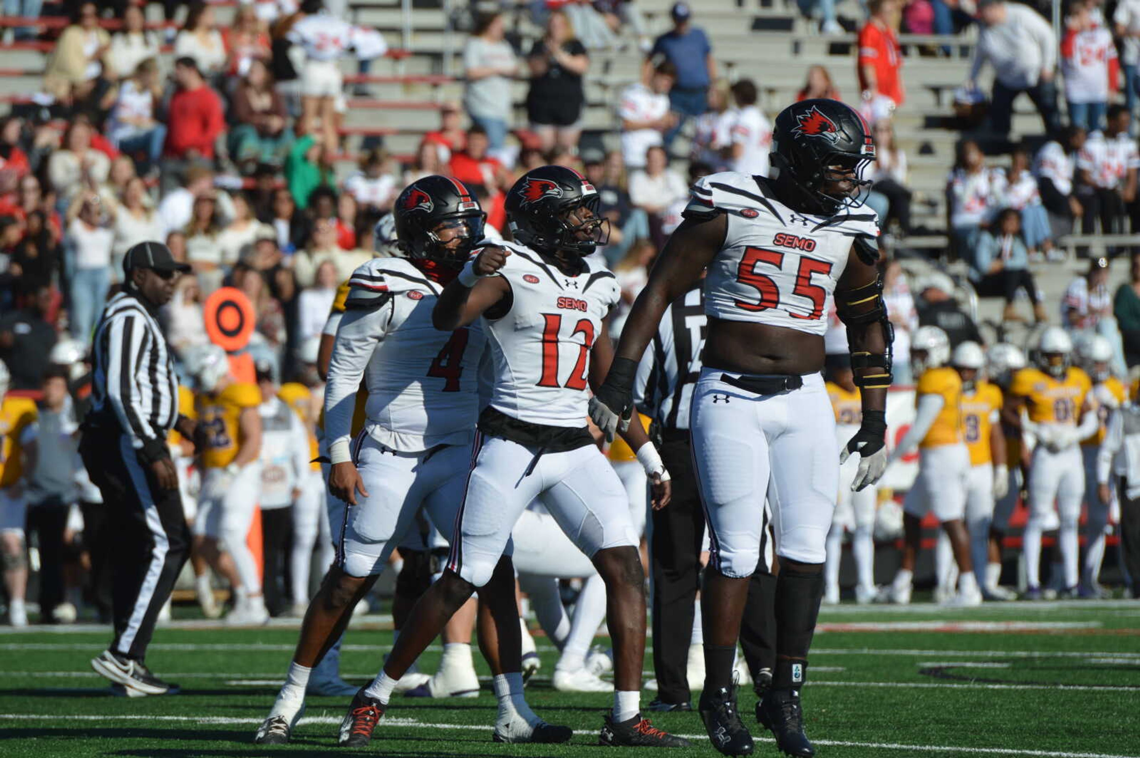 Southeast Missouri State linebacker Sam Cook, center, celebrates with his Redhawk teammates following a big third-down stop against Western Illinois on Nov. 16 at Houck Field in Cape Girardeau.