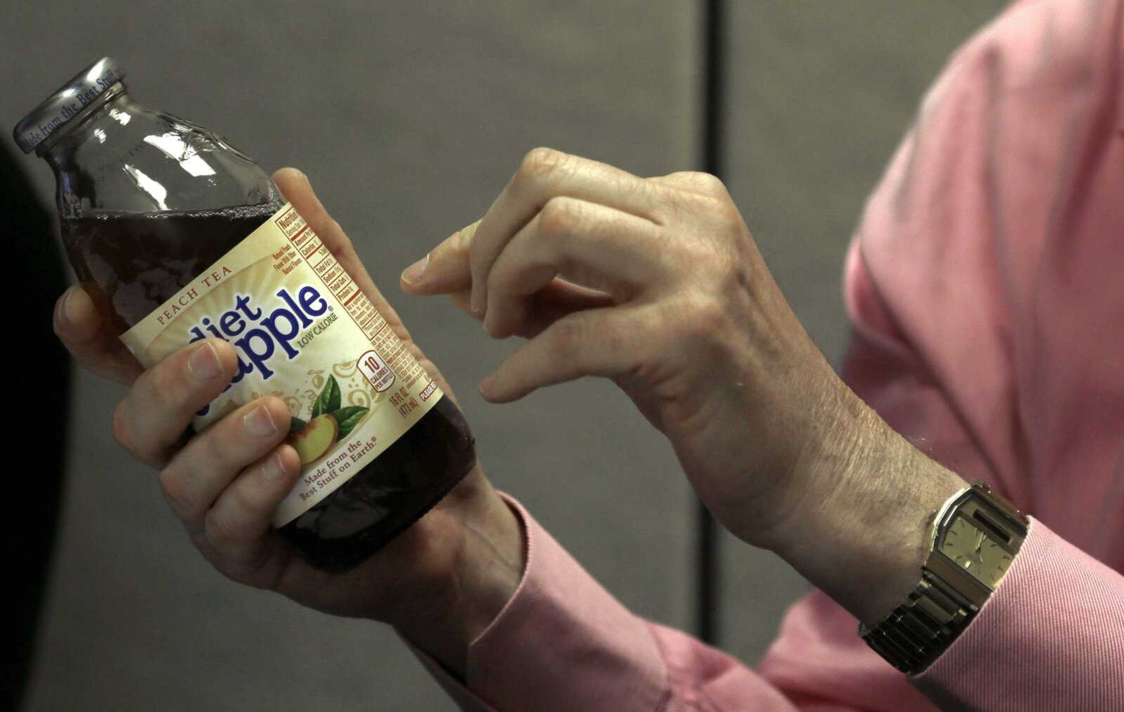 Nutrition scholar Prof. Barry Popkin, head of the University of North Carolina Food Research Program, points to an ingredient label April 3 while discussing his study, what foods Americans are purchasing in stores and eating, in his office at UNC-Chapel Hill. (Gerry Broome ~ Associated Press)