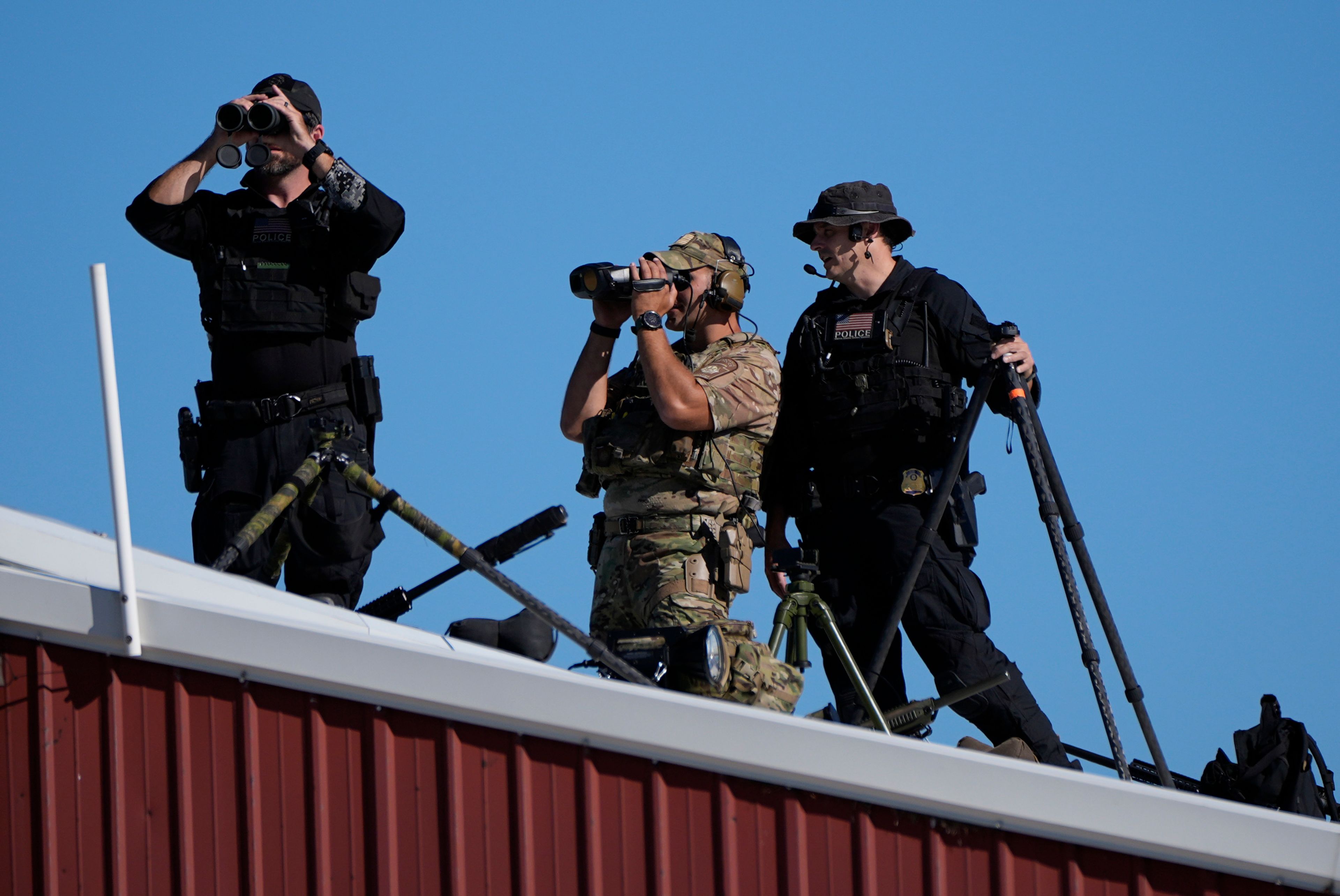 Members of law enforcement look on at a campaign event for Republican presidential nominee former President Donald Trump at the Butler Farm Show, Saturday, Oct. 5, 2024, in Butler, Pa. (AP Photo/Alex Brandon)