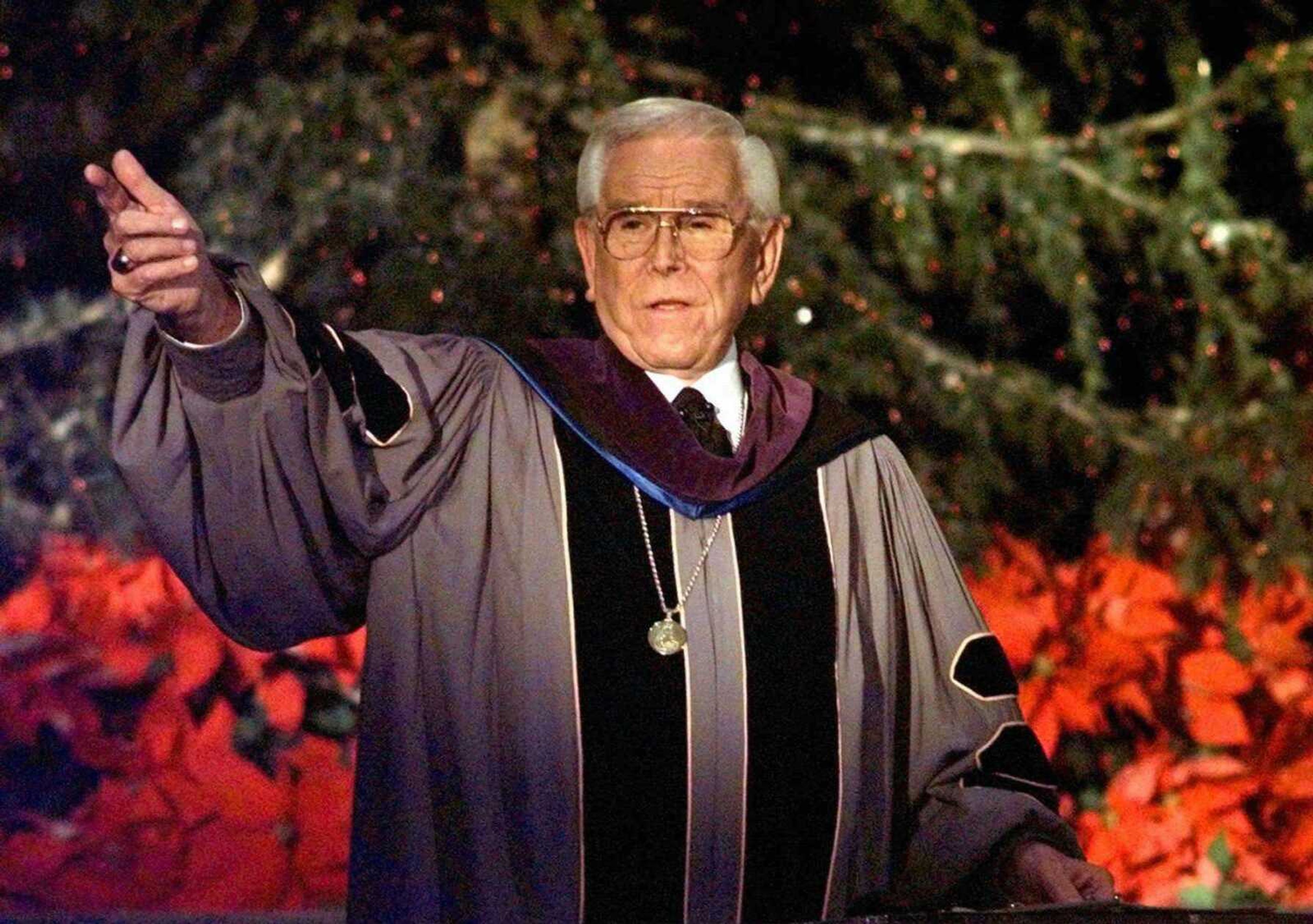 In this Dec. 24, 1997 photo, the Rev. Robert H. Schuller delivers one of seven candlelight Christmas Eve Service from the Crystal Cathedral pulpit in Garden Grove, Calif. (Kevork Djansezian ~ Associated Press)