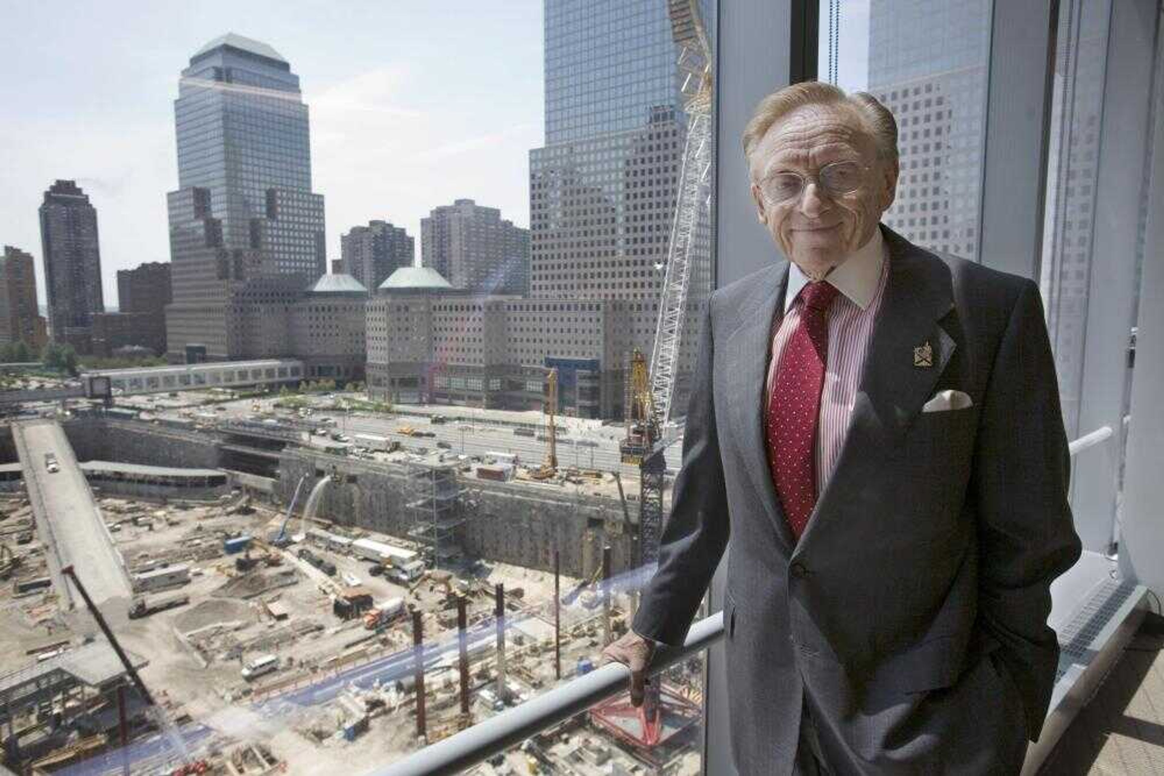 World Trade Center developer Larry Silverstein posed for a portrait Wednesday in his office overlooking the site in New York. The builders of the World Trade Center site and seven insurers have reached a $2 billion settlement that ends all outstanding legal battles over its multibillion-dollar policy, state officials said Wednesday. (Mark Lennihan ~ Associated Press)