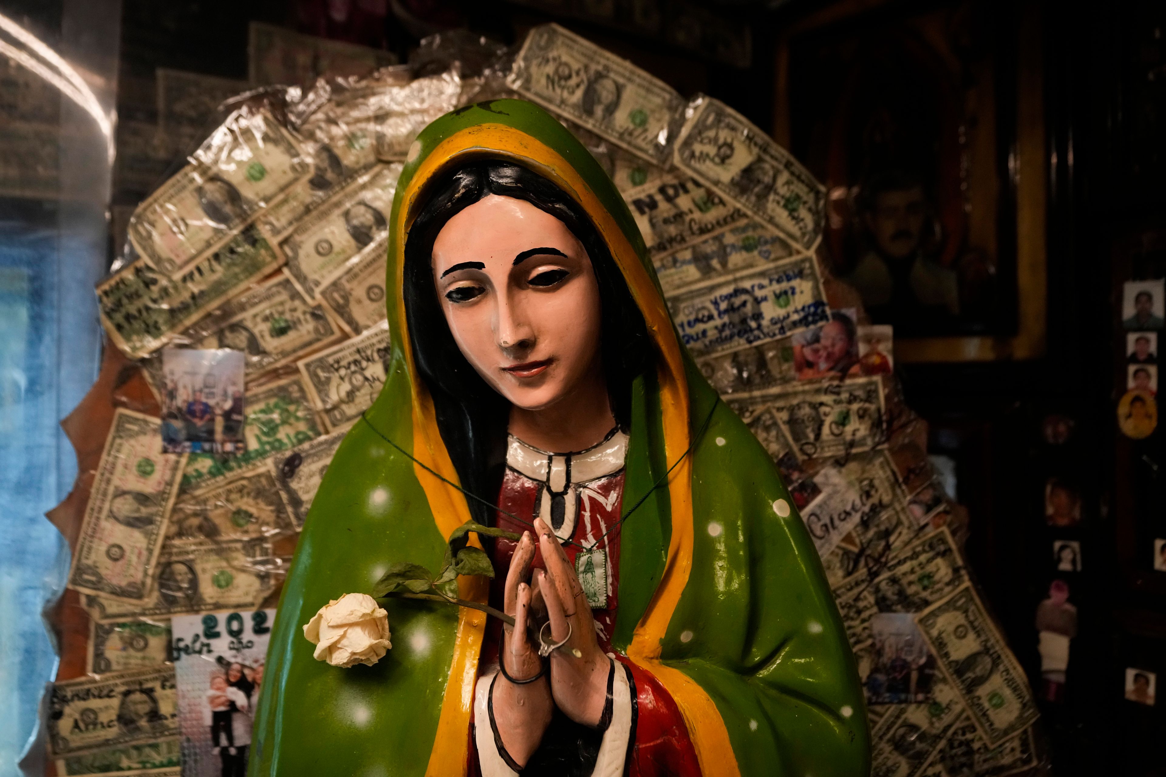 A statue of the Virgin of Guadalupe sits inside a shrine to Jesus Malverde, a folk saint viewed as the protector of people involved in the drug trade, in Culiacan, Mexico, Sept. 20, 2024. (AP Photo/Eduardo Verdugo)