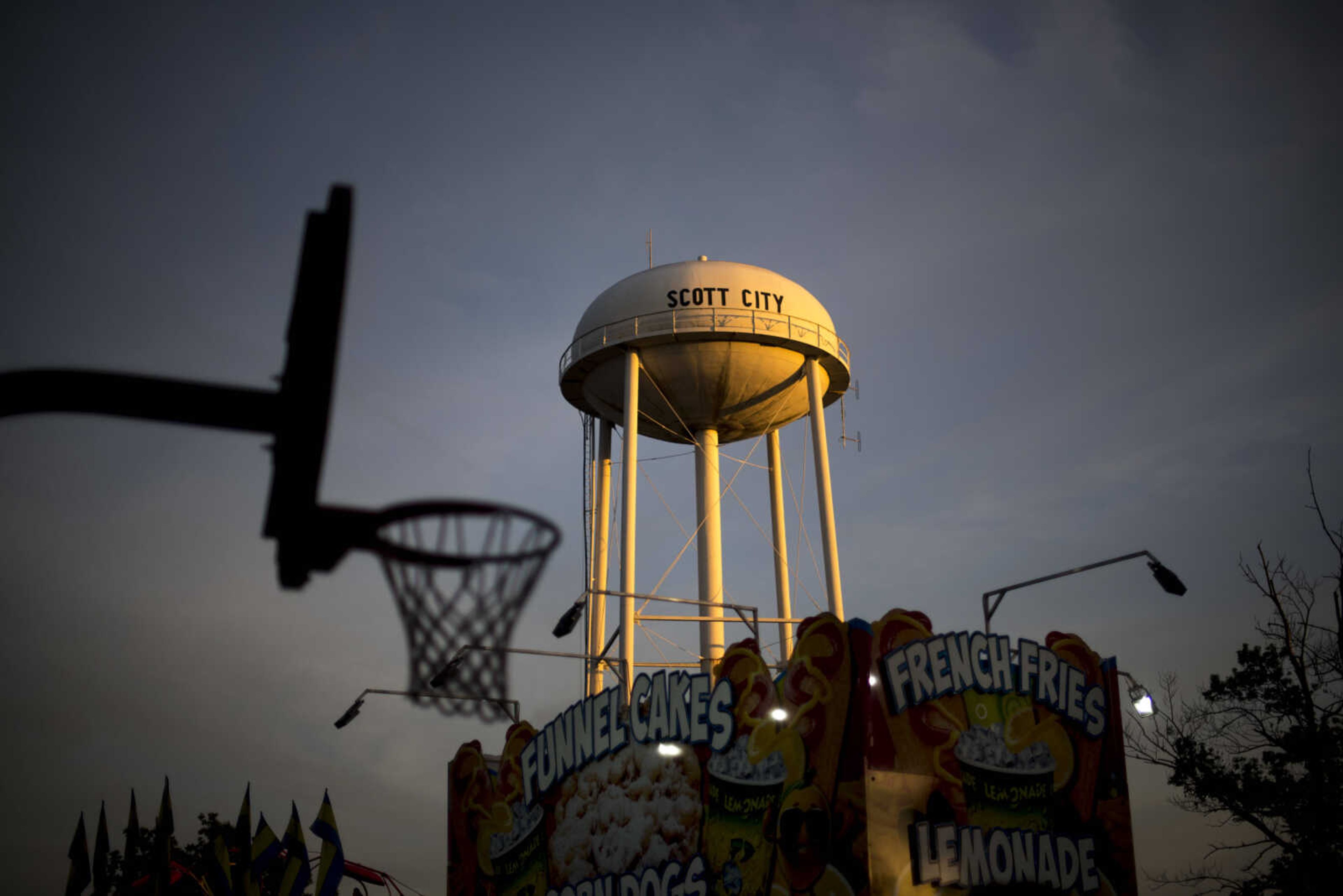 The sun sets over the Scott City water tower during the 41st annual Mid-Summer Festival Friday, June 16, 2017 at Scott City Park.