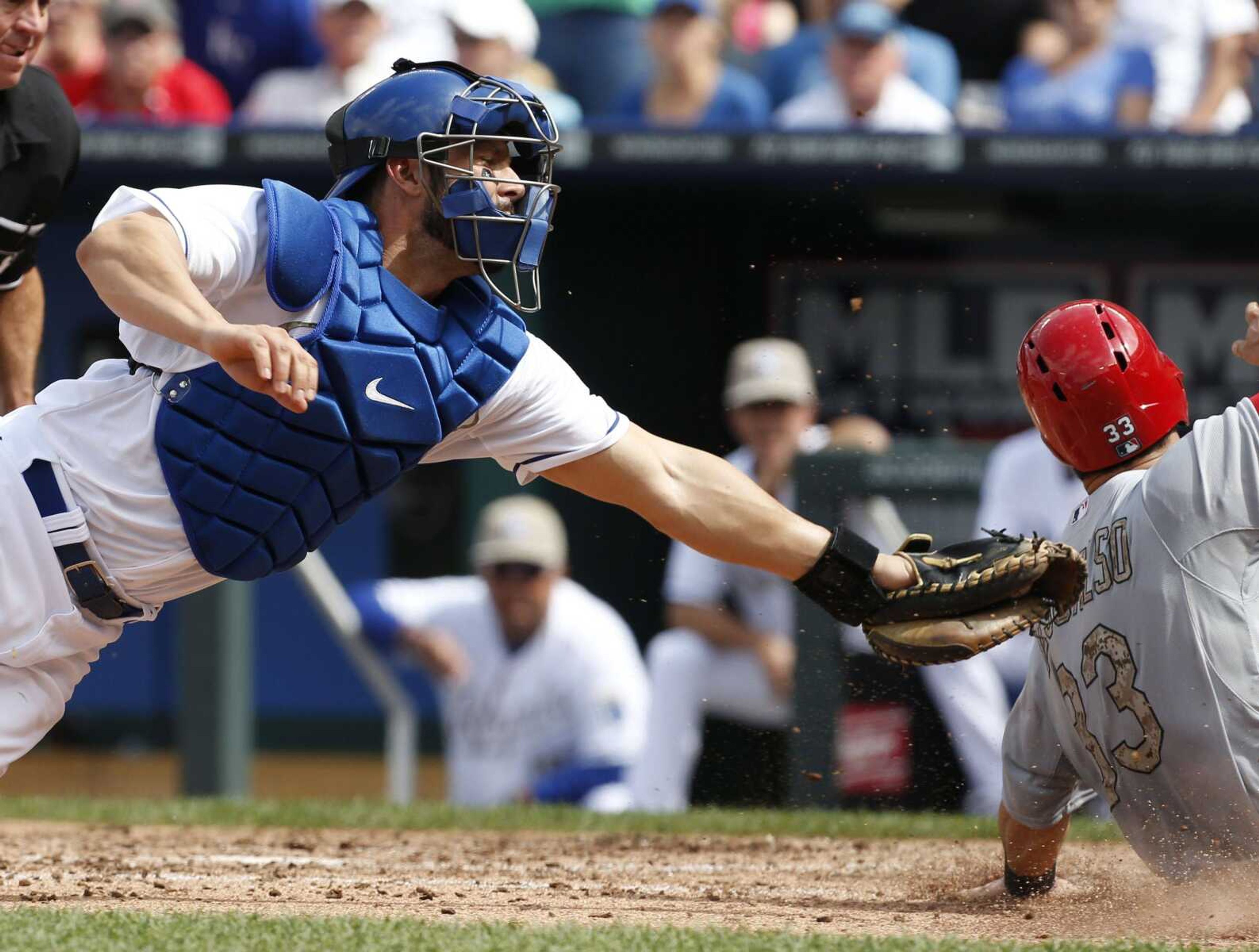 Kansas City Royals catcher George Kottaras fails to tag St. Louis Cardinals' Daniel Descalso (33) during the sixth inning of a baseball game at Kauffman Stadium in Kansas City, Mo., Monday, May 27, 2013. (AP Photo/Orlin Wagner)