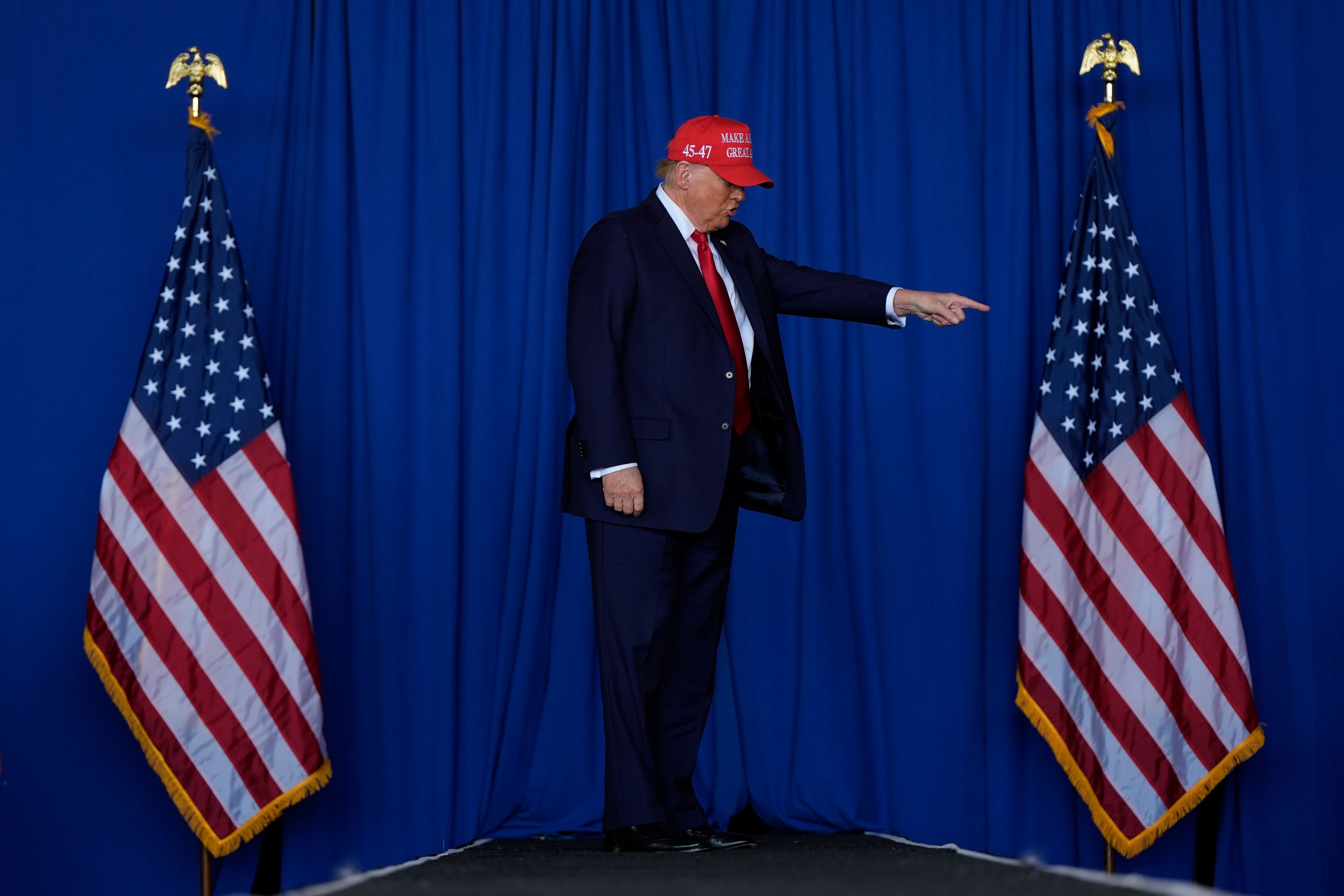 Republican presidential nominee former President Donald Trump arrives to speak during a campaign rally at Dodge County Airport, Sunday, Oct. 6, 2024, in Juneau, Wis. (AP Photo/Julia Demaree Nikhinson)