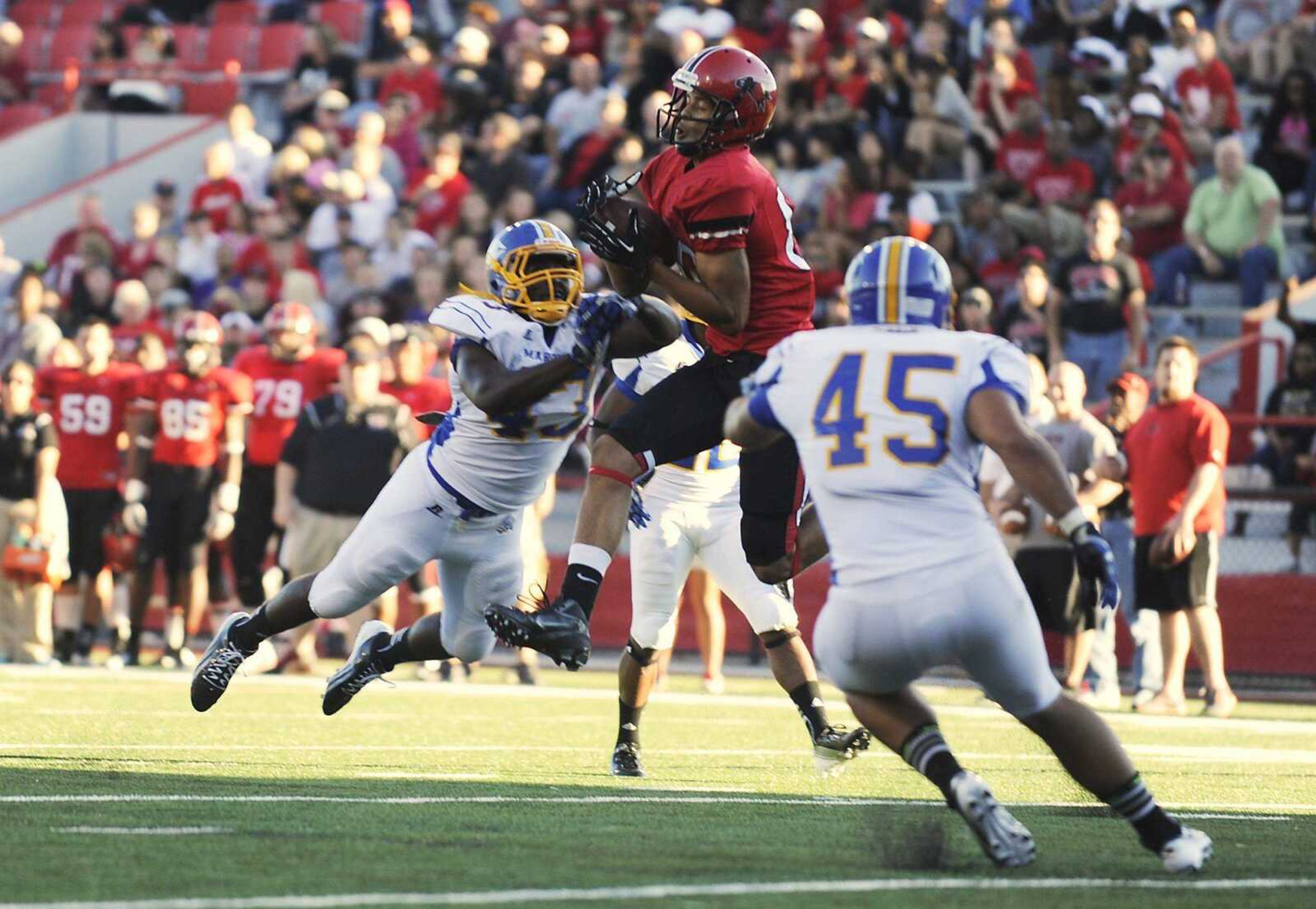 Southeast Missouri State wide receiver D.J. Foster brings down a pass from quarterback Scott Lathrop deep in Mars Hill territory during the Redhawks 30-18 win over the Lions Saturday at Houck Stadium. (ADAM VOGLER)