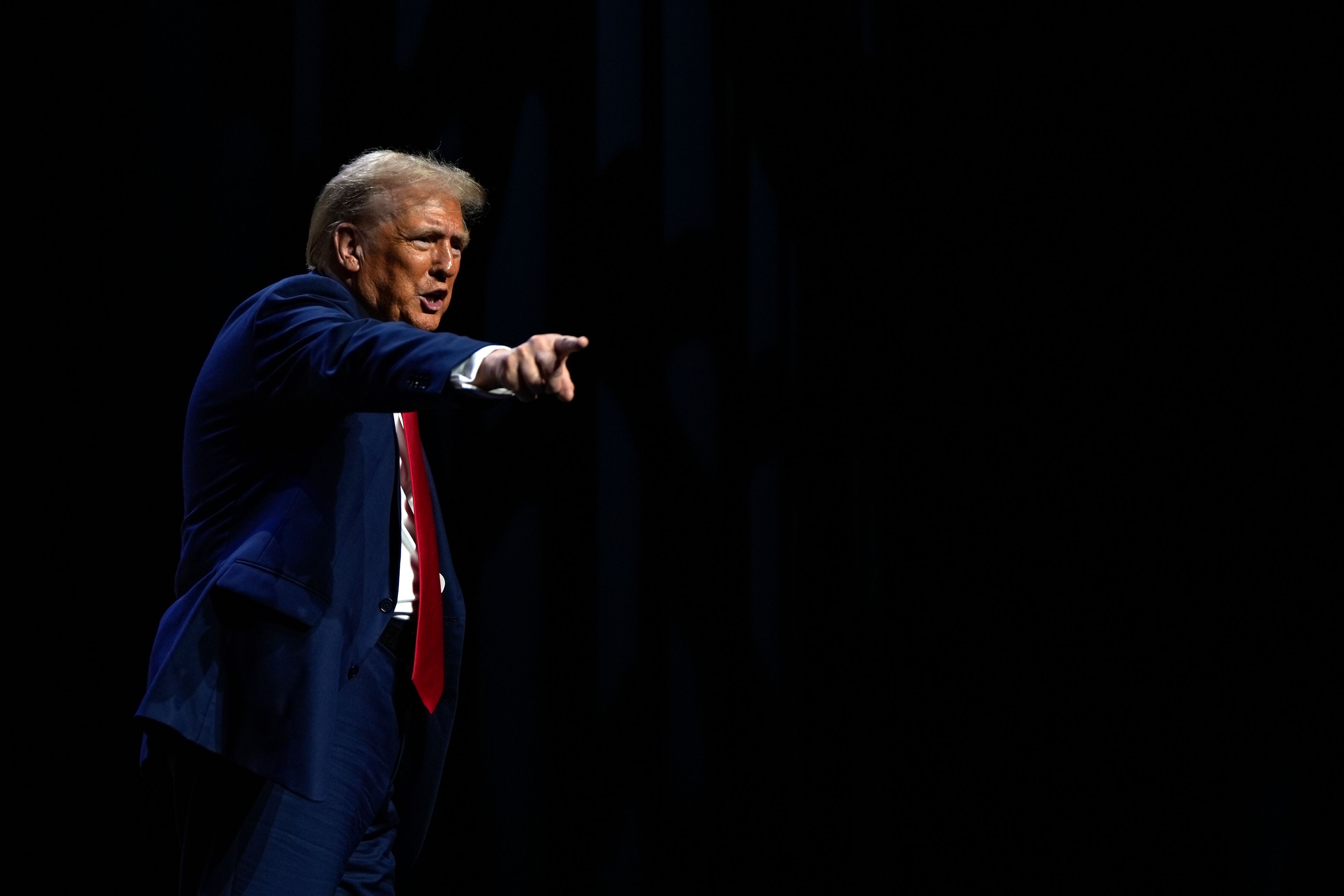 Republican presidential nominee former President Donald Trump departs a meeting of the Detroit Economic Club, Thursday, Oct. 10, 2024, in Detroit. (AP Photo/Julia Demaree Nikhinson)