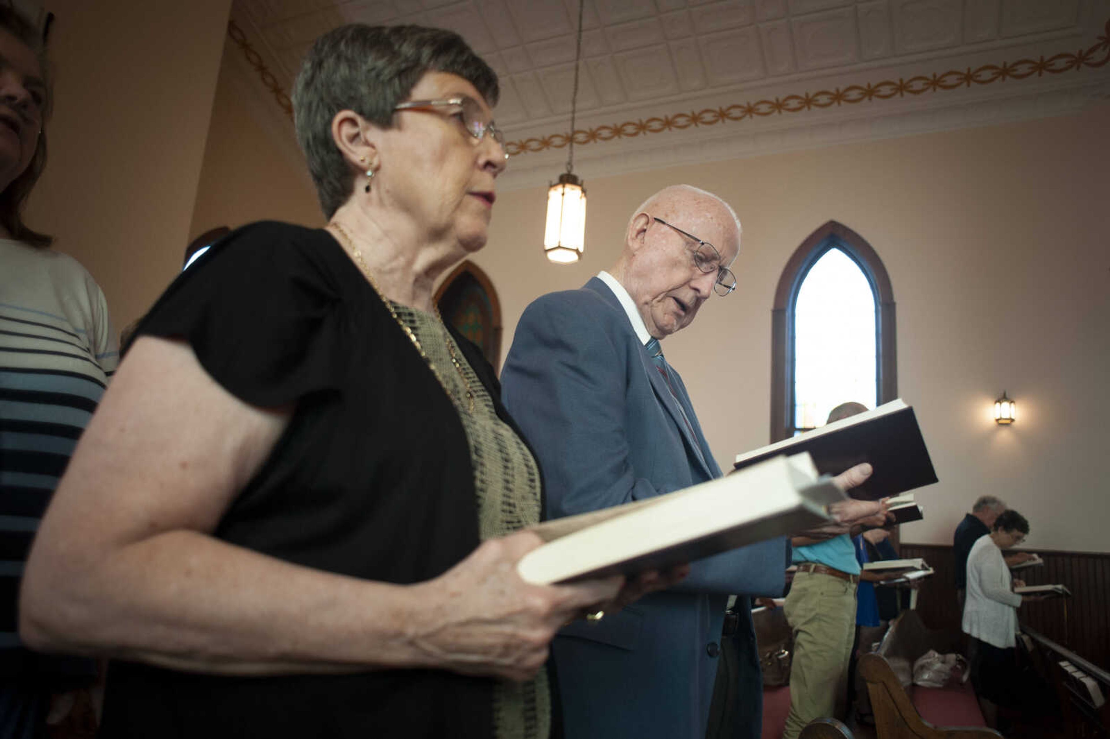 The Rev. David Dissen, right, and his wife, Judy Dissen, participate in a church service Sunday, July 14, 2019, at Zion Lutheran Church in Gordonville. On July 5, Dissen celebrated the 60th anniversary of his ordination. "I love the work. I love the people," Dissen said about his profession. Since retiring in 1998, Dissen has been filling vacancies in parishes and now he and Judy attend Zion Lutheran Church in Gordonville where he will also fill in at times.