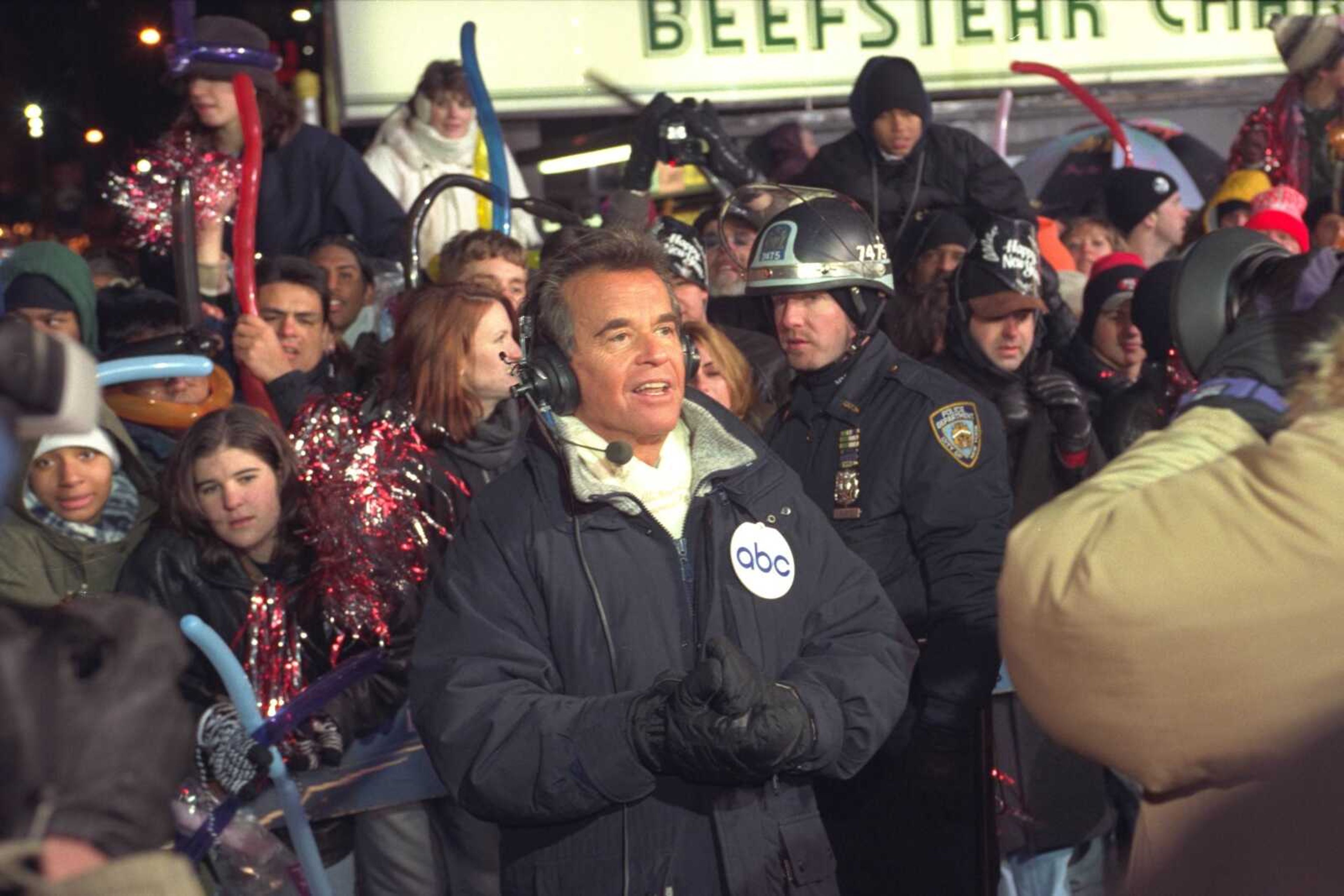 FILE - In this Dec. 31, 1996 file photo, Dick Clark broadcasts during New Year's festivities from Times Square in  New York. Clark, the television host who helped bring rock `n' roll into the mainstream on "American Bandstand," died Wednesday, April 18, 2012 of a heart attack. He was 82. (AP Photo/Wally Santana)