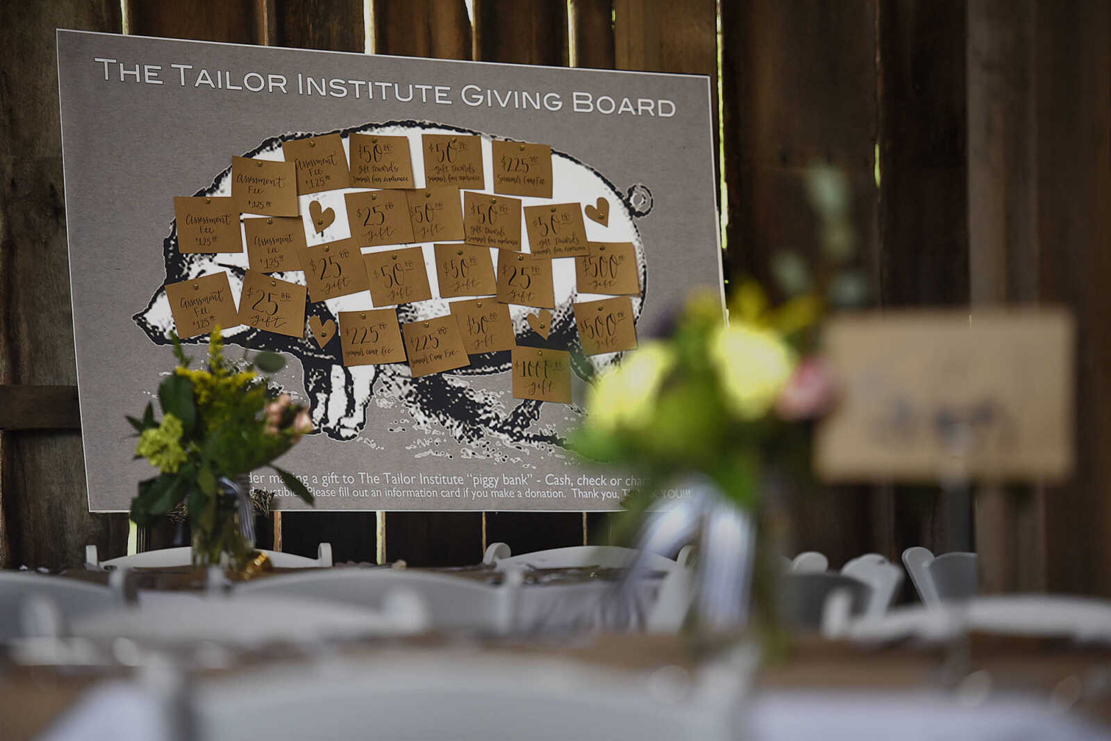 Decorations fill the barn at Rusted Route Farms on April 29, 2017 during a Swine & Dine pig roast benefiting The Tailor Institute.